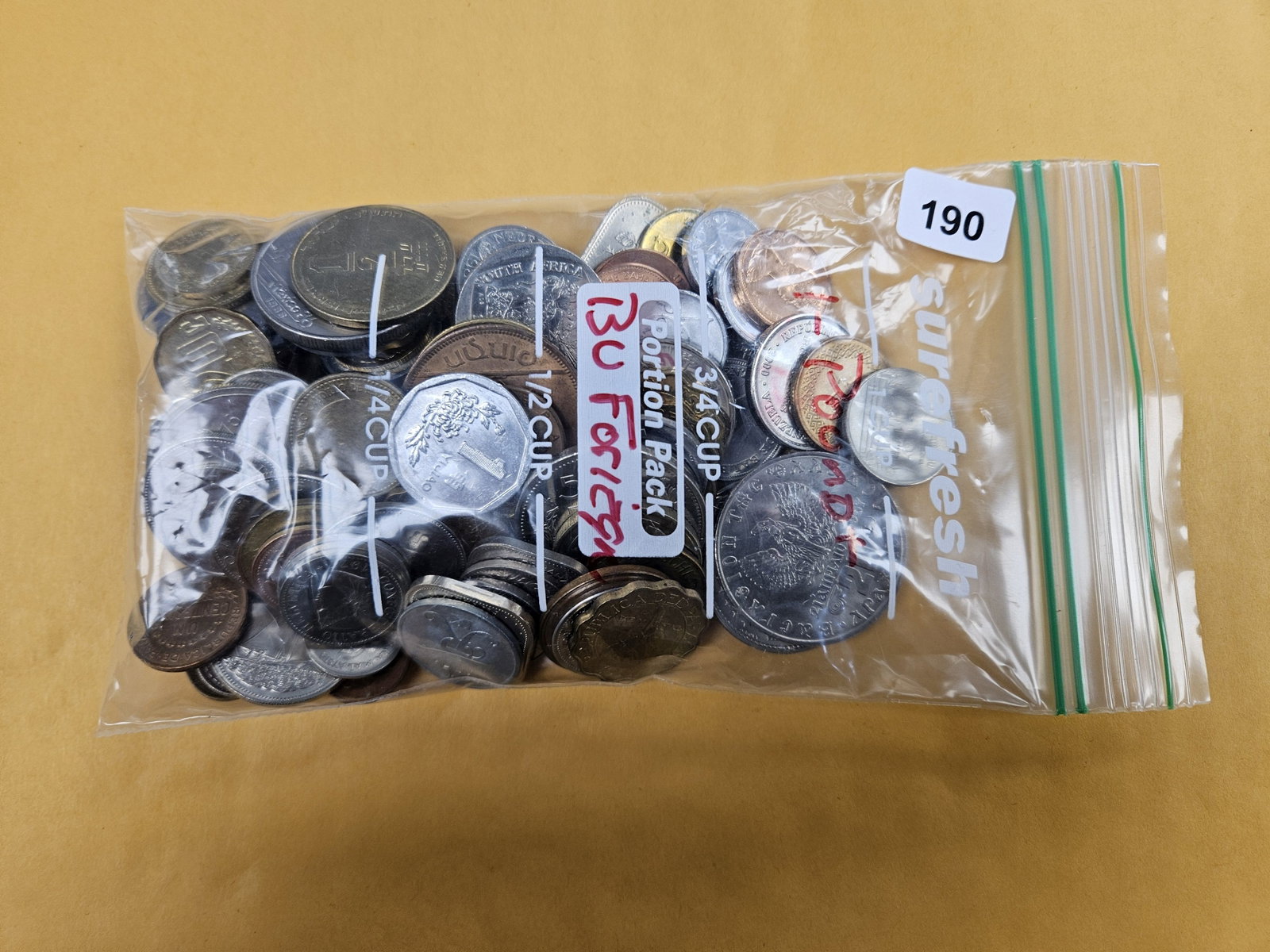 ONE POUND of Mixed Brilliant Uncirculated World Coins: From dealer. Unsearched by us