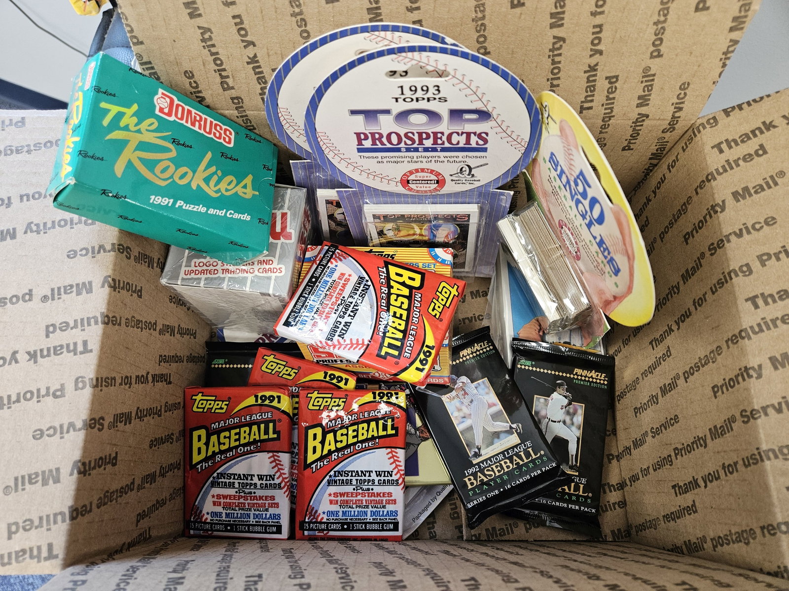 BASEBALL CARDS!: Ships Separately in a Flat Rate Medium Box. Mixed. I think they're 80's and 90s. Most unopened. Nice mix. Will throw a few more in to fill up the box