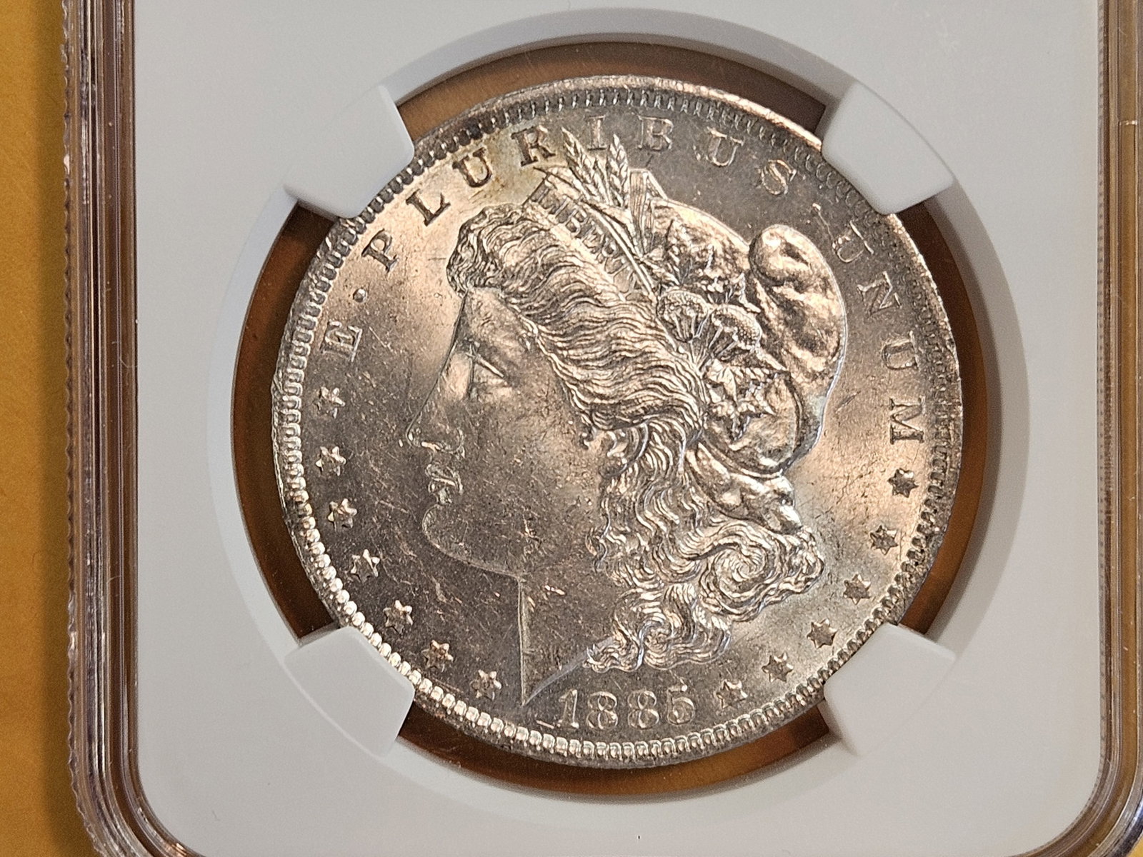 NGC 1885-O Morgan Dollar in Brilliant About Uncirculated - 58: Pretty much unc
