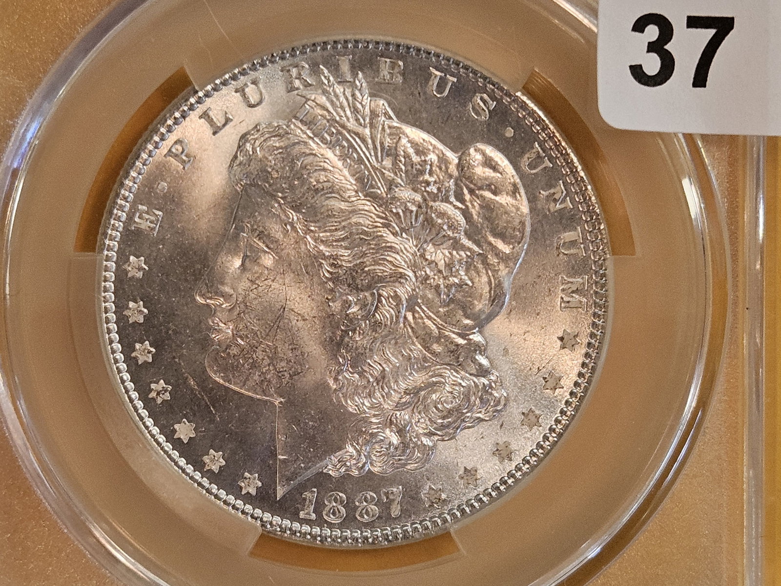 CACG 1887 Morgan Dollar in Mint State 63 (1 of 3)
