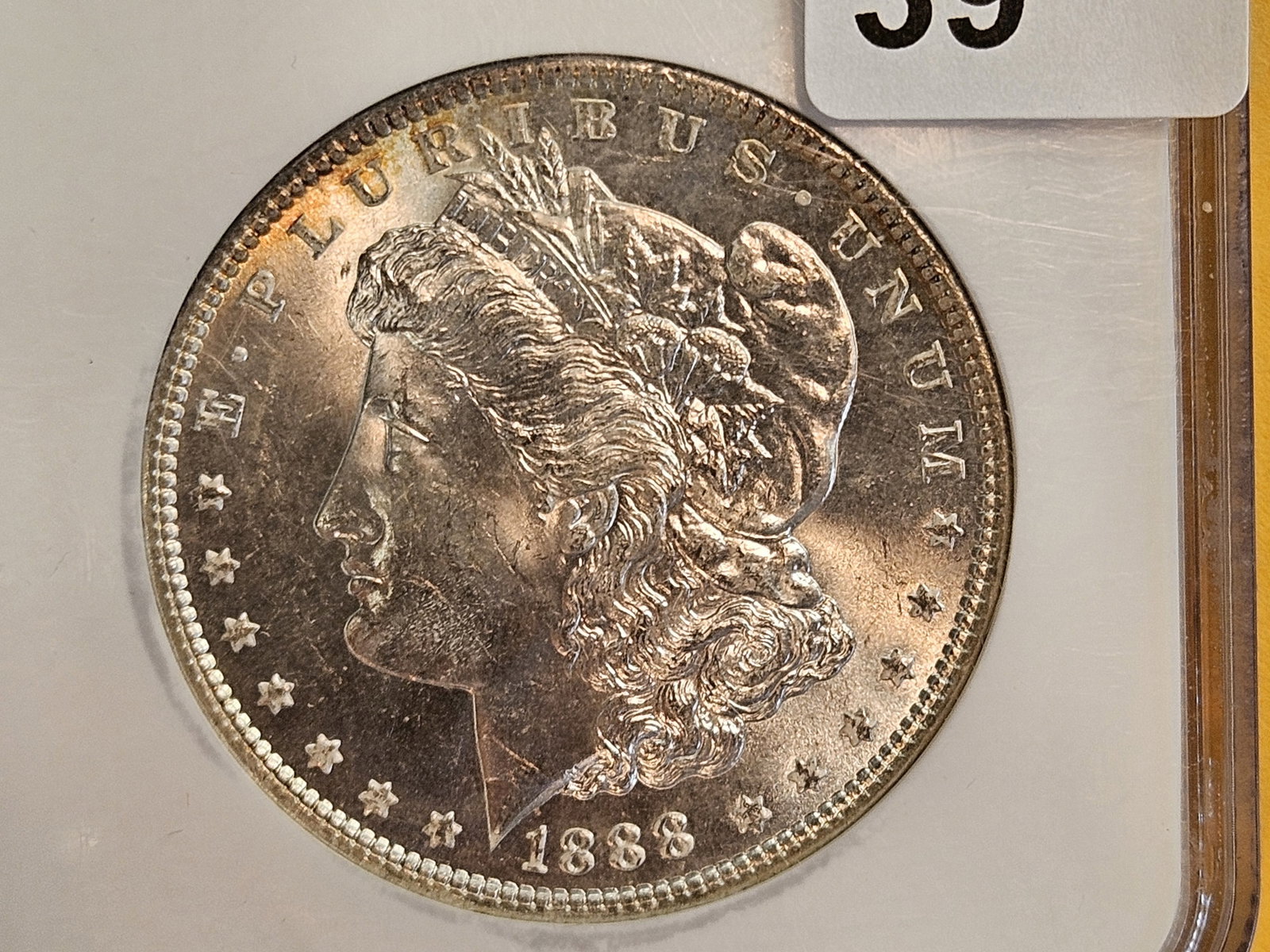 NGC 1888 Morgan Dollar in Mint State 63: Near Prooflike fields