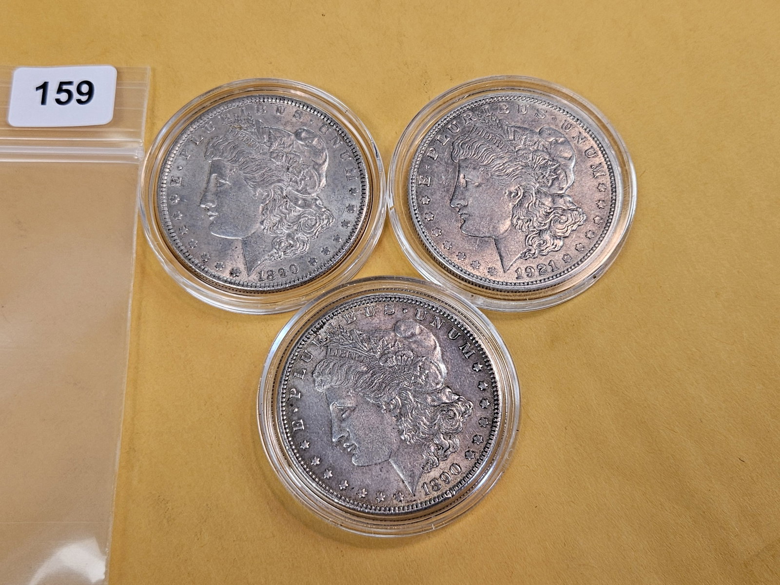 Three mixed Morgan silver dollars - 2
