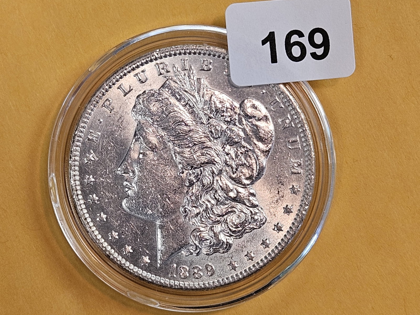 Brilliant Uncirculated Plus 1889 Morgan Dollar: In capsule