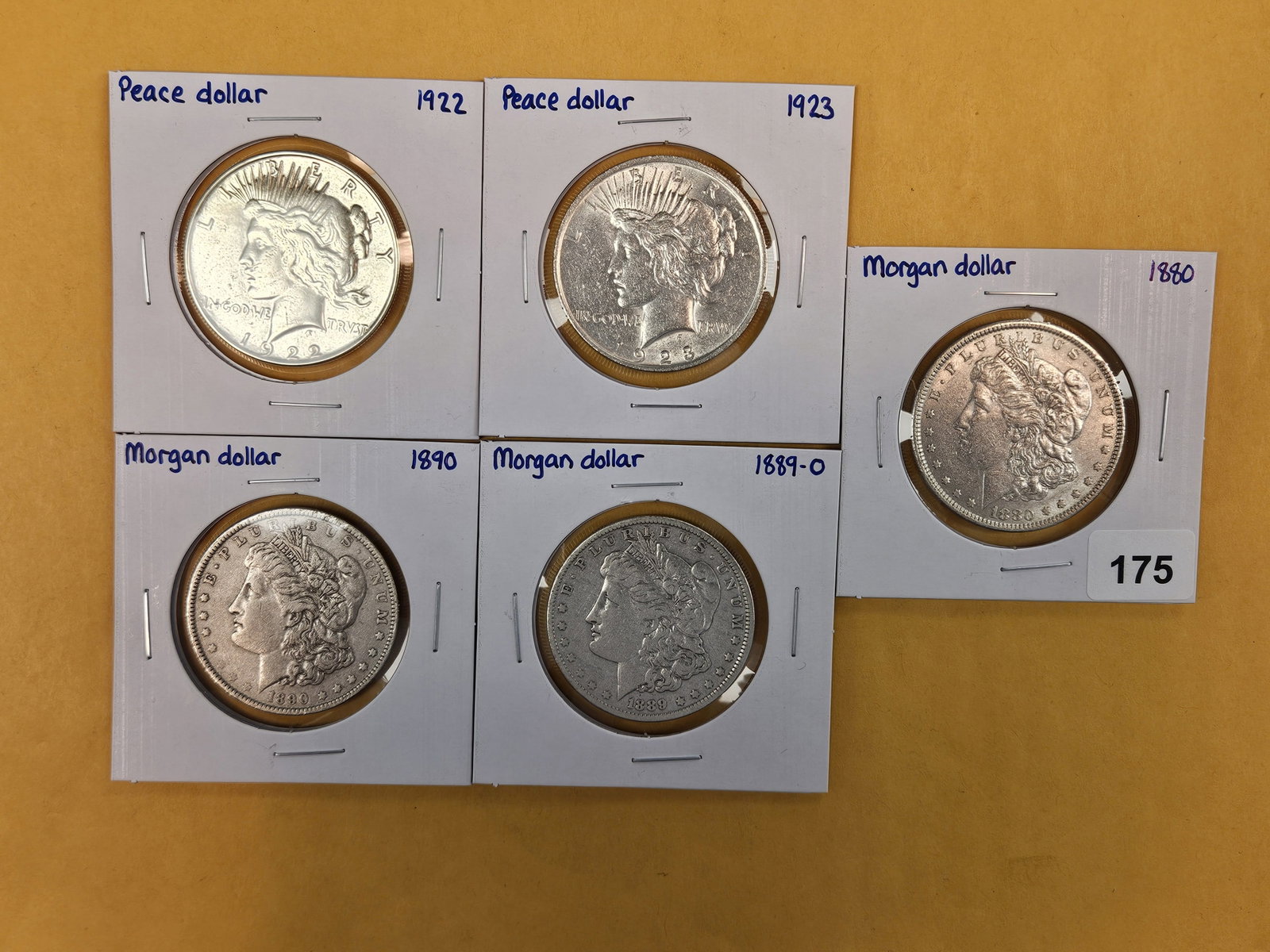Five mixed Morgan and Peace silver Dollars: Mixed dates and grades