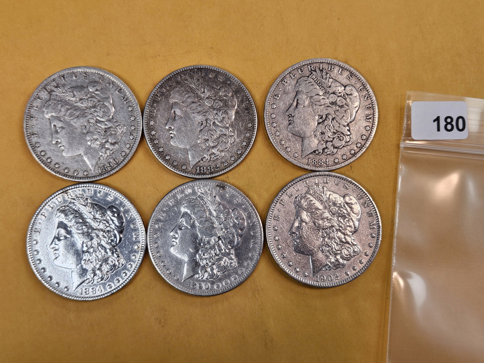 Six mixed Morgan silver Dollars: Mixed dates and grades
