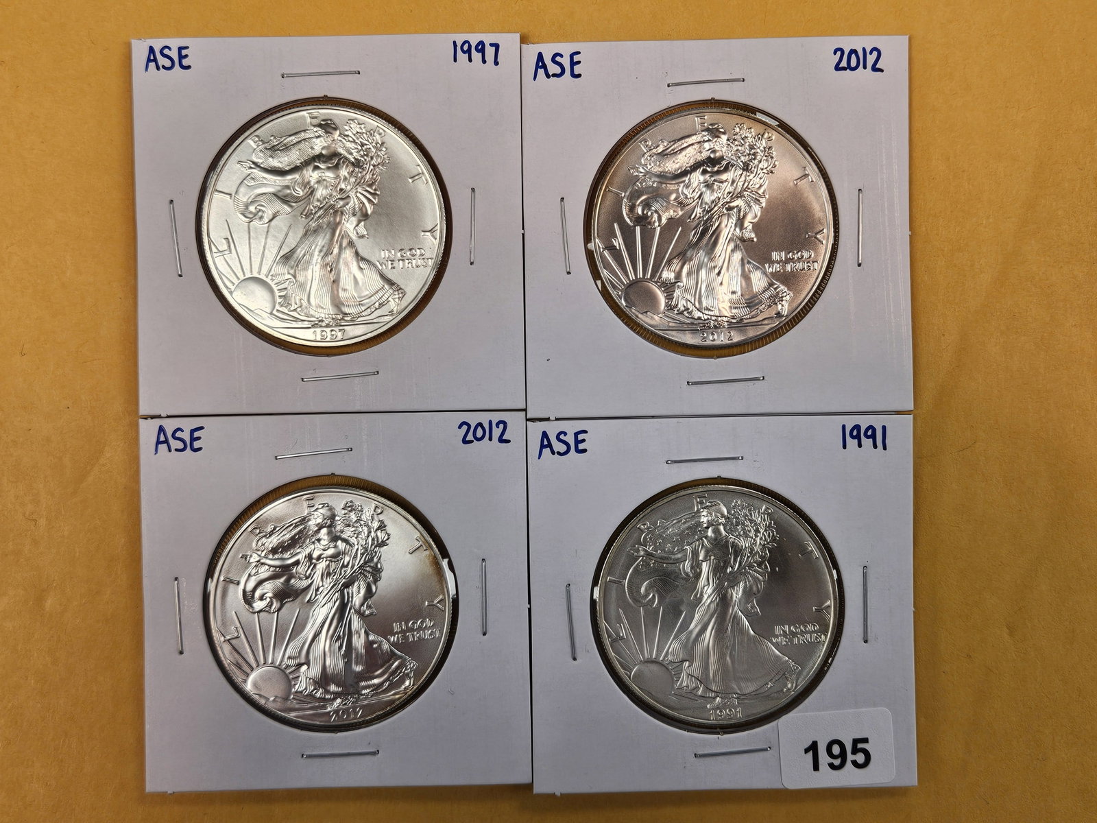 Four GEM Brilliant Uncirculated American Silver Eagles: Mixed.