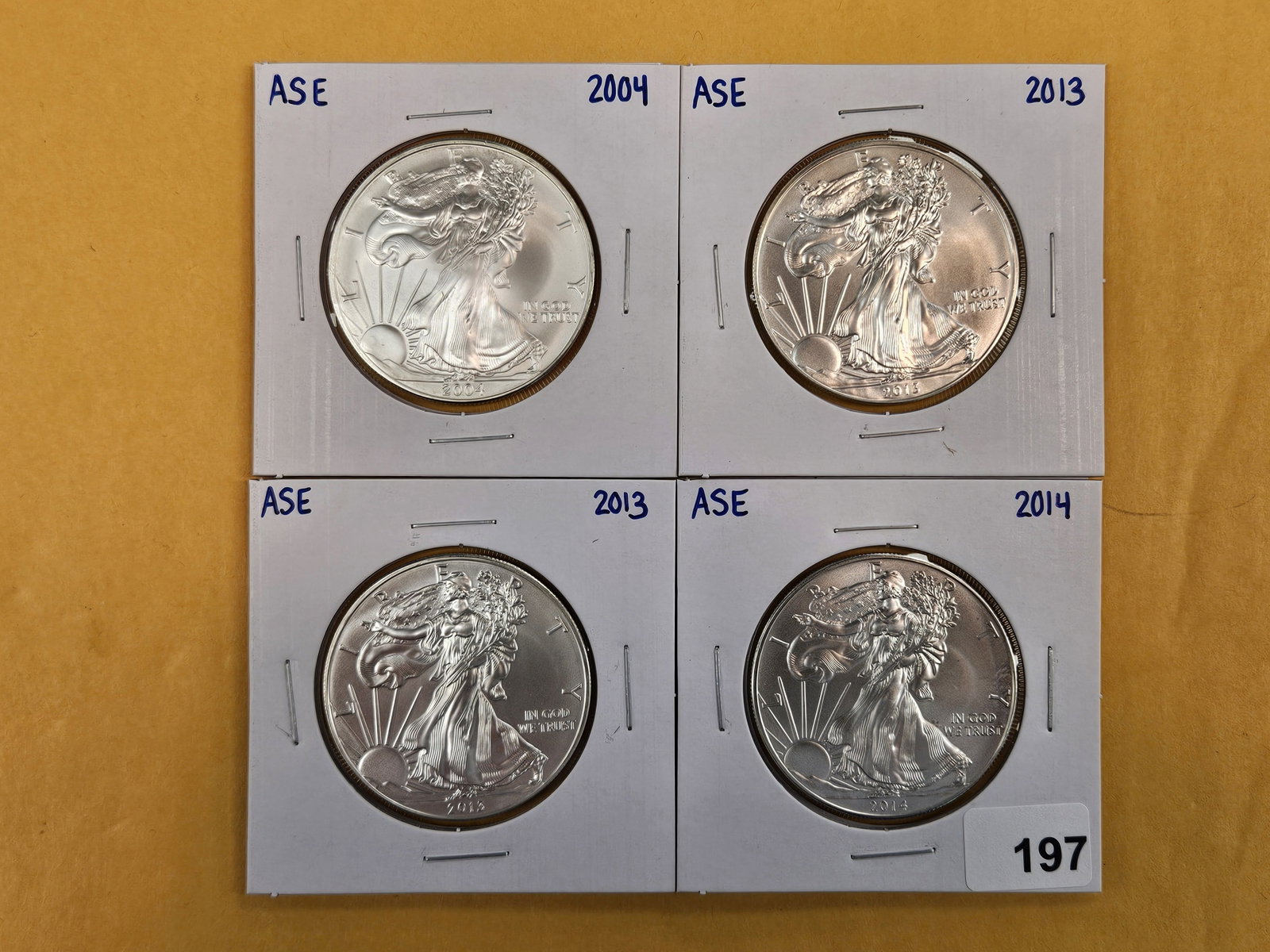 Four GEM Brilliant Uncirculated American Silver Eagles: Mixed.