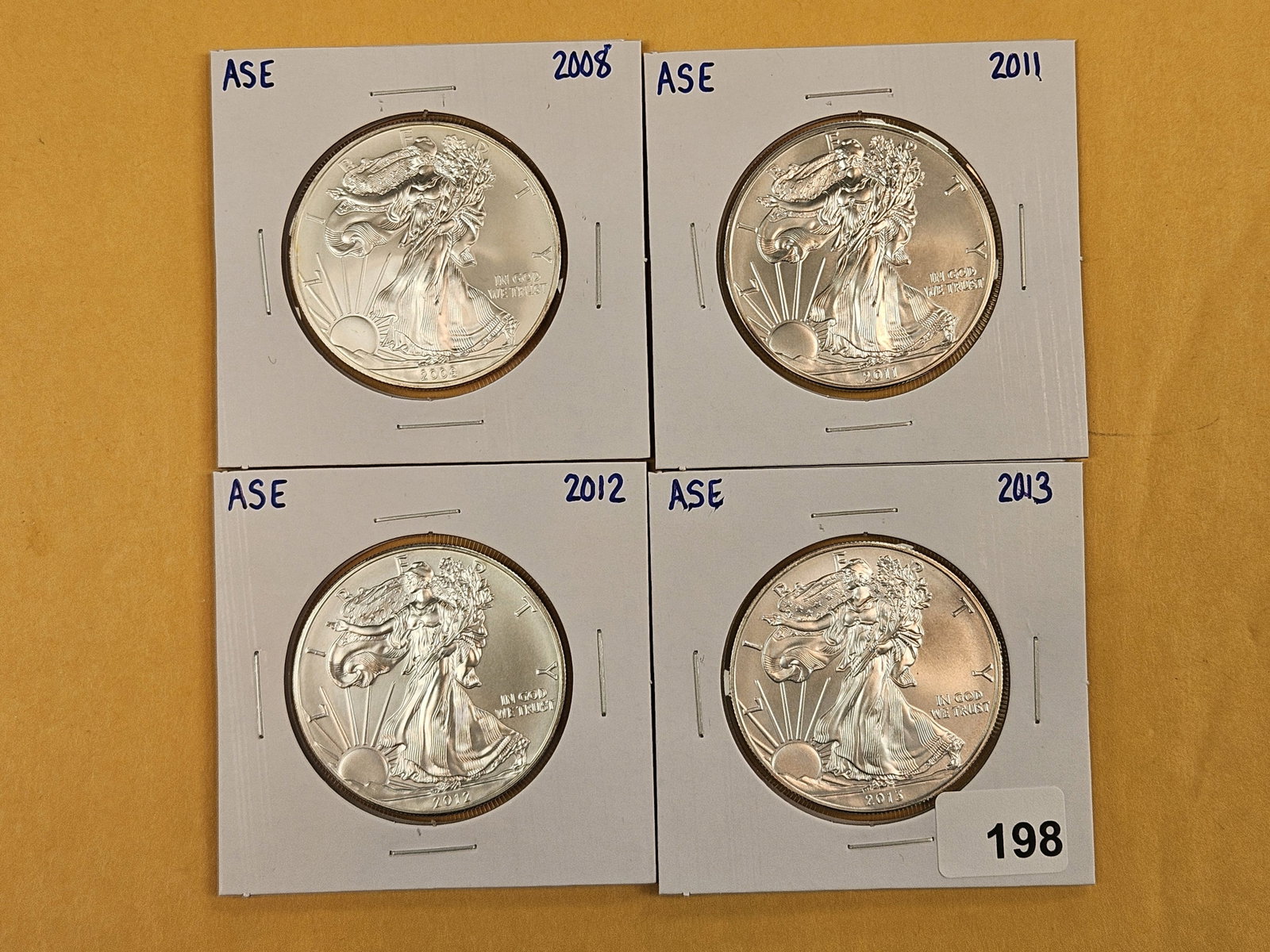 Four GEM Brilliant Uncirculated American Silver Eagles: Mixed.
