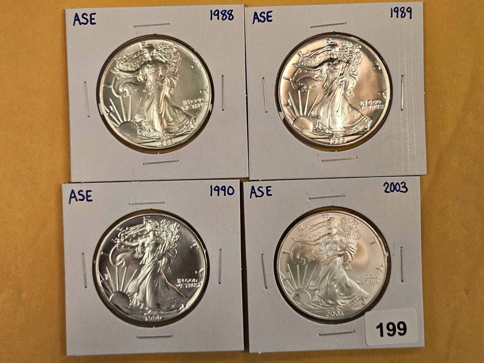 Four GEM Brilliant Uncirculated American Silver Eagles: Mixed.