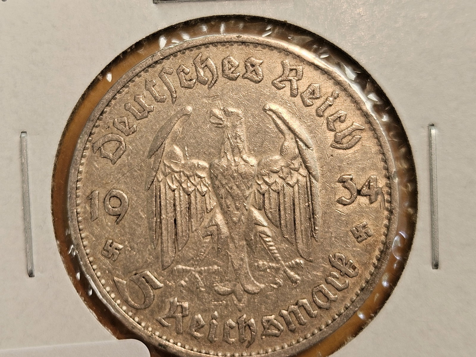 About Uncirculated 1934-D German silver 5 reichsmark: Church on reverse