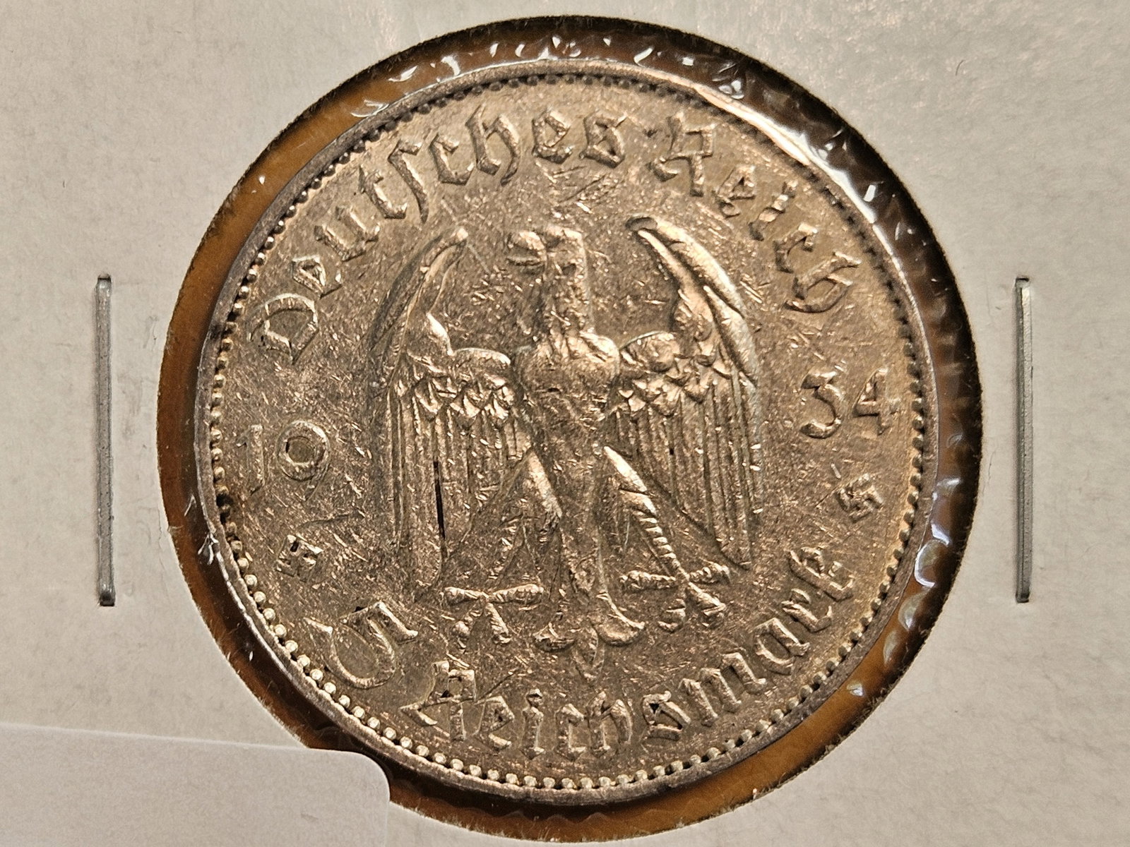 About Uncirculated 1934-F German silver 5 reichsmark: Church on reverse