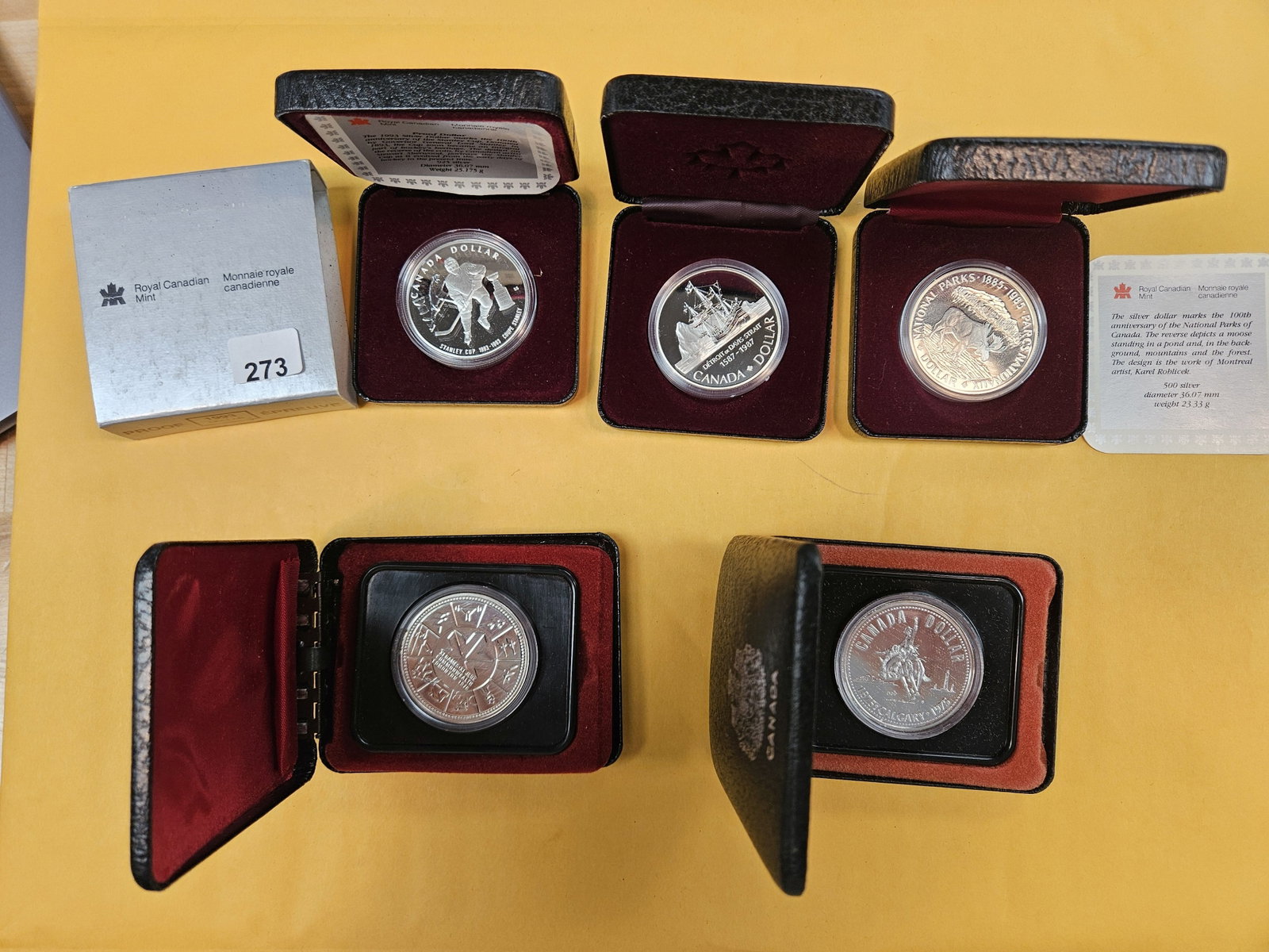 Five GEM Canadian Silver Dollars: All in original boxes. Some with COAs