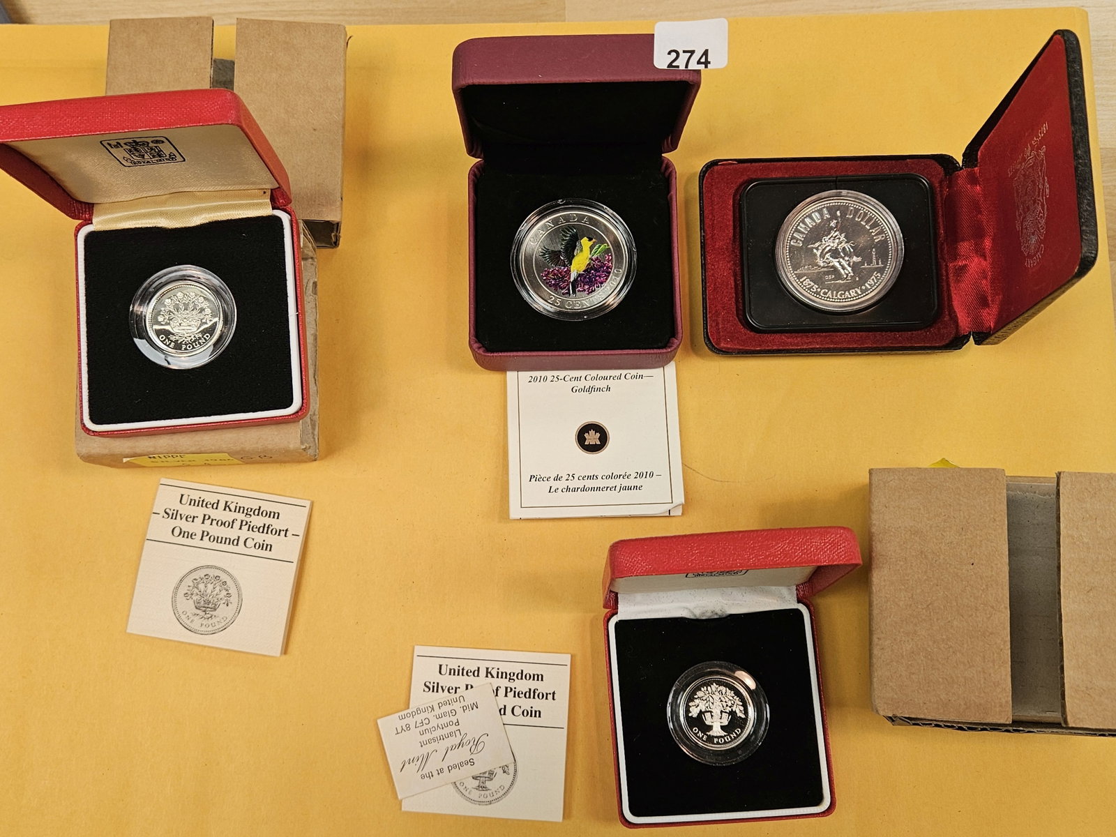 Four mixed GEM Silver World coins in OGP (1 of 5)