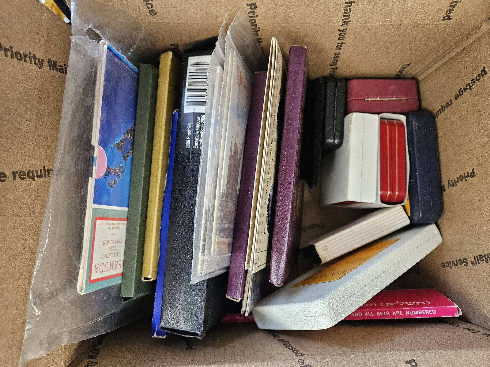 TWENTY mixed World coin sets: Some BU. Some Proof. Might be a little silver on there, but not a whole lot. Ships separately in a Flat Rate Medium Box