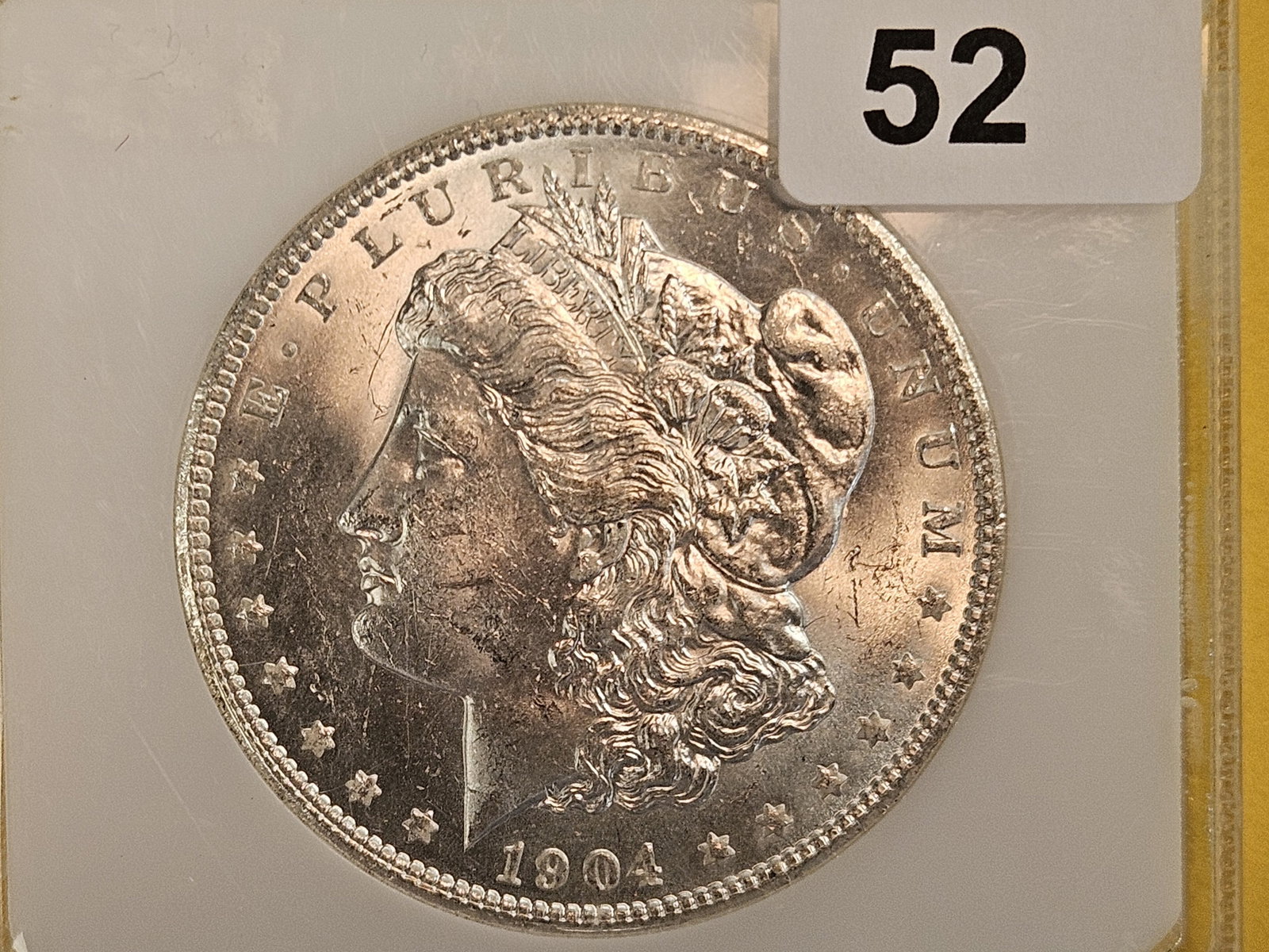PCI 1904-O Morgan Dollar in Mint State 62: Very clean. Looks better than a 62!
