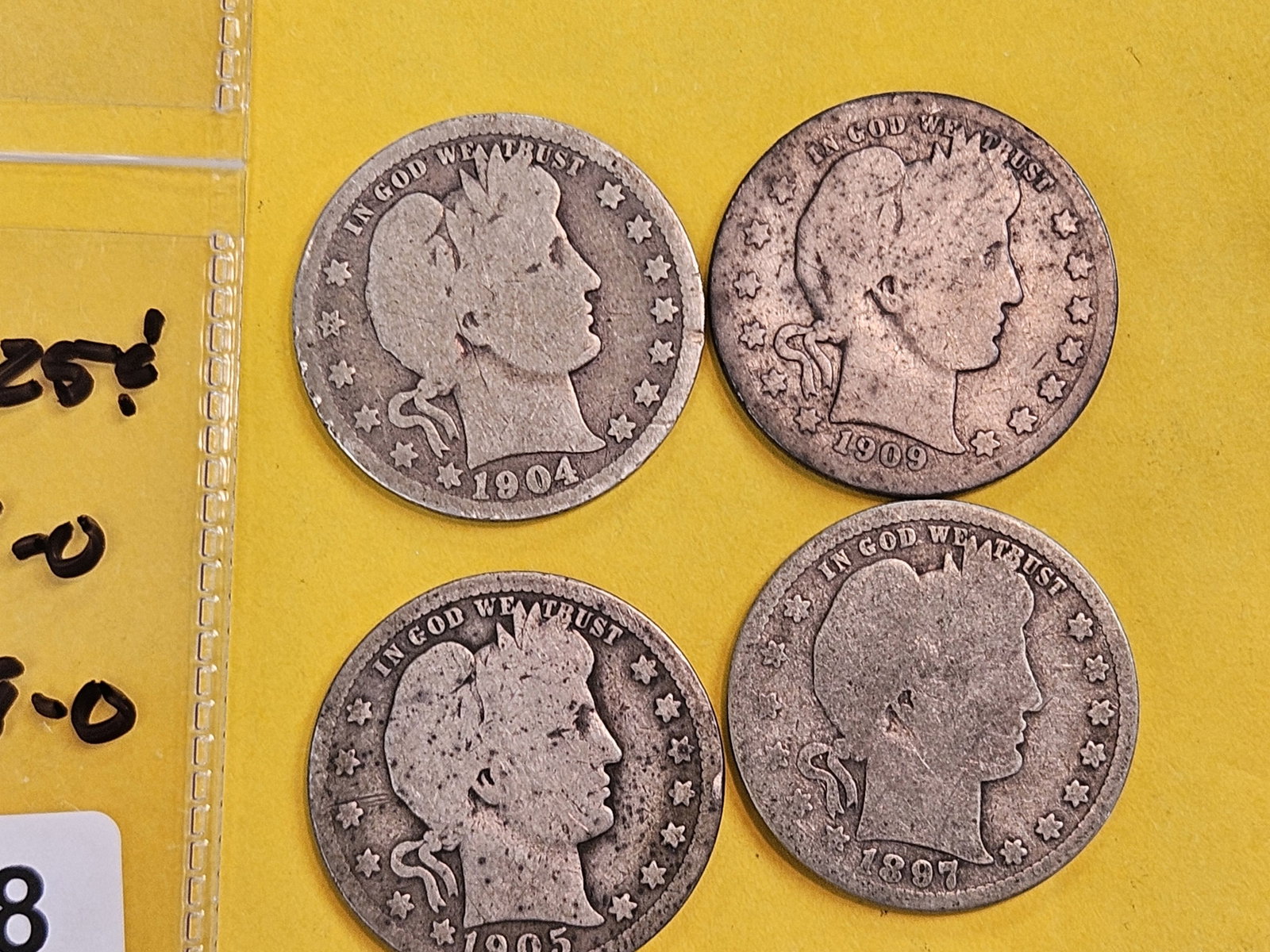 Four better date Barber silver quarters: 1897-S, 1904-O, 1905 and 1909-O