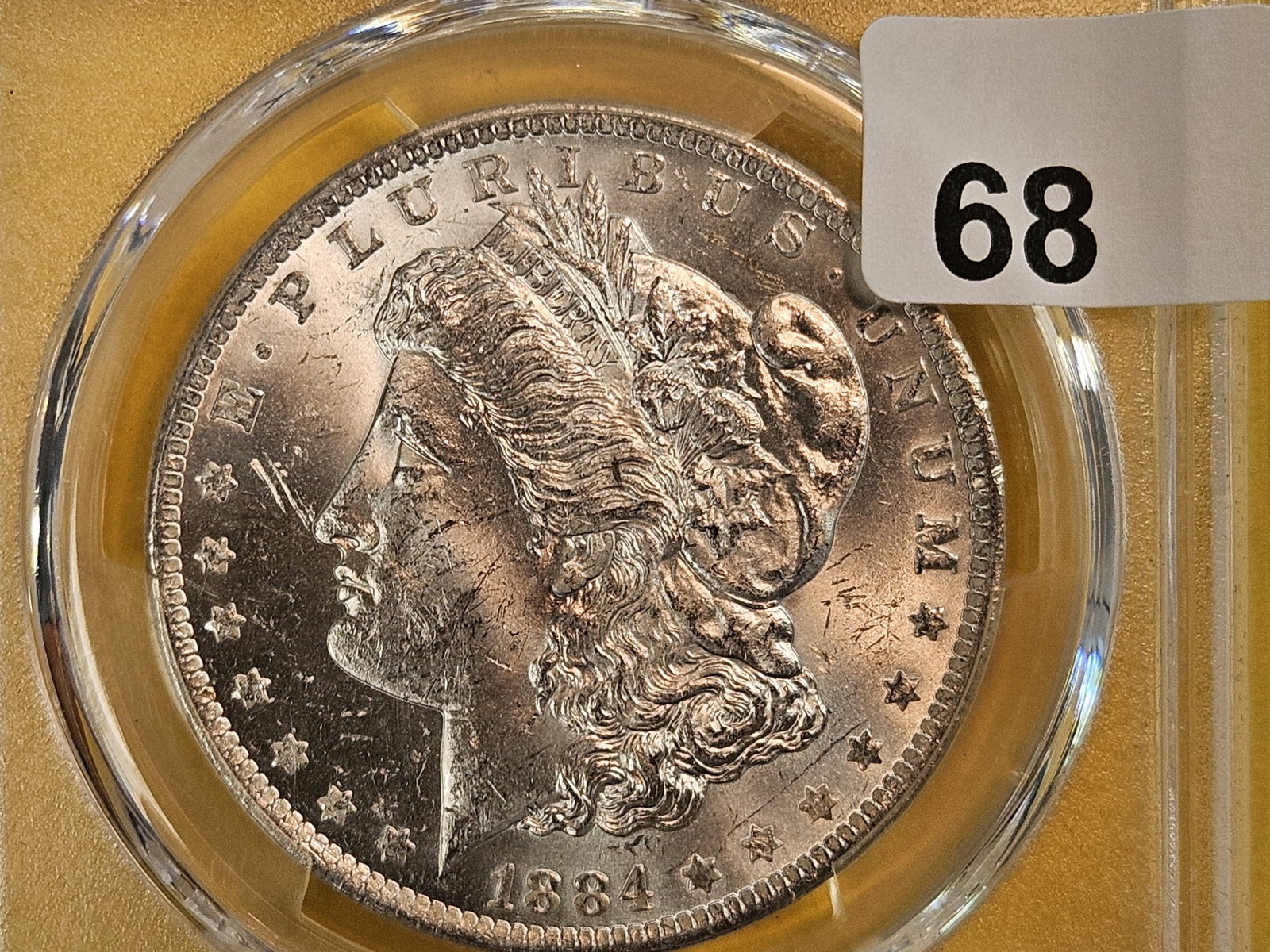 PCGS 1884-O Morgan Dollar in Mint State 63 (1 of 3)