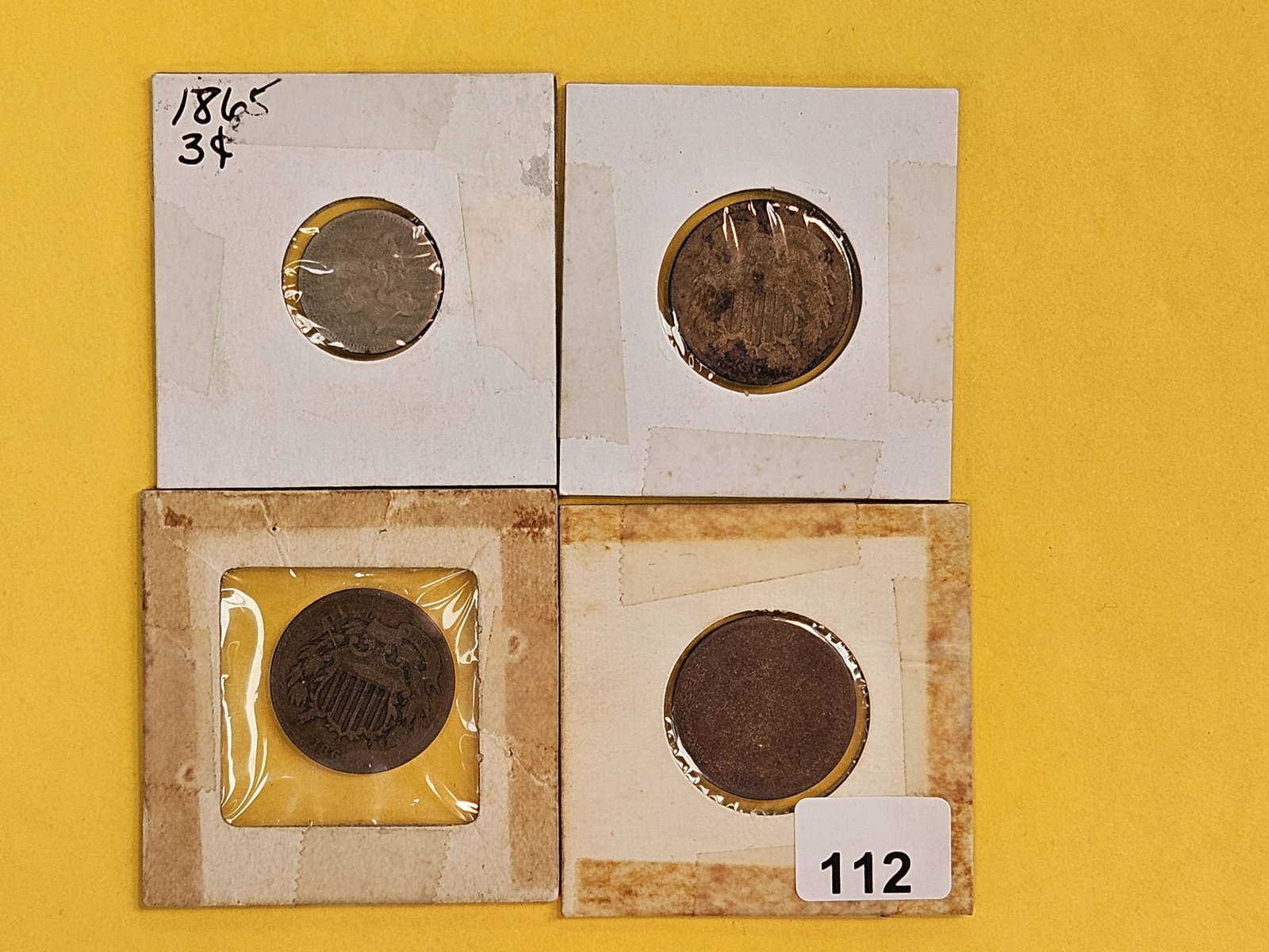 Four mixed odd-denomination coins (1 of 6)