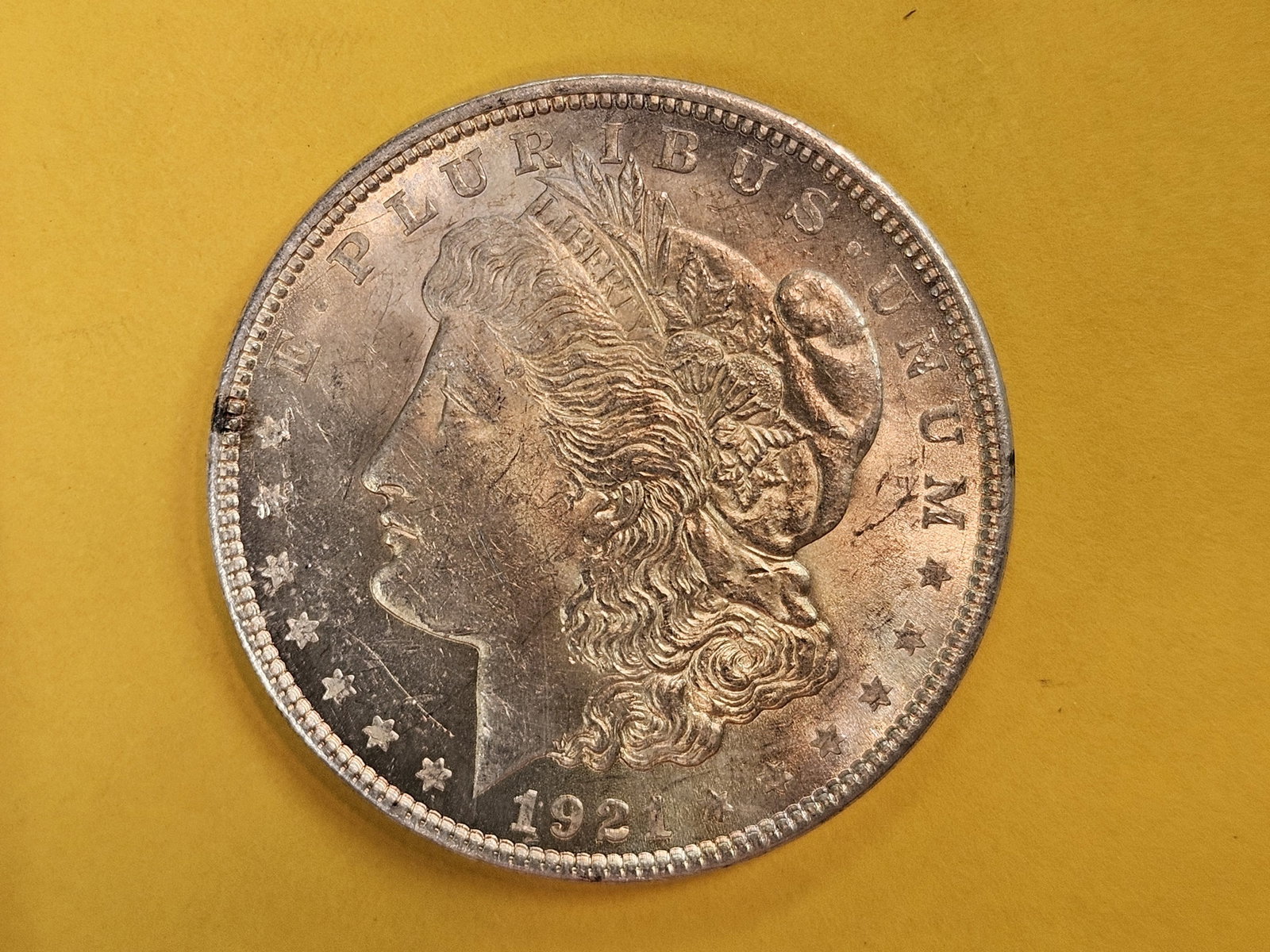 Choice Brilliant Uncirculated PLus 1921 Morgan Dollar: Has some very nice patina. Great colors!