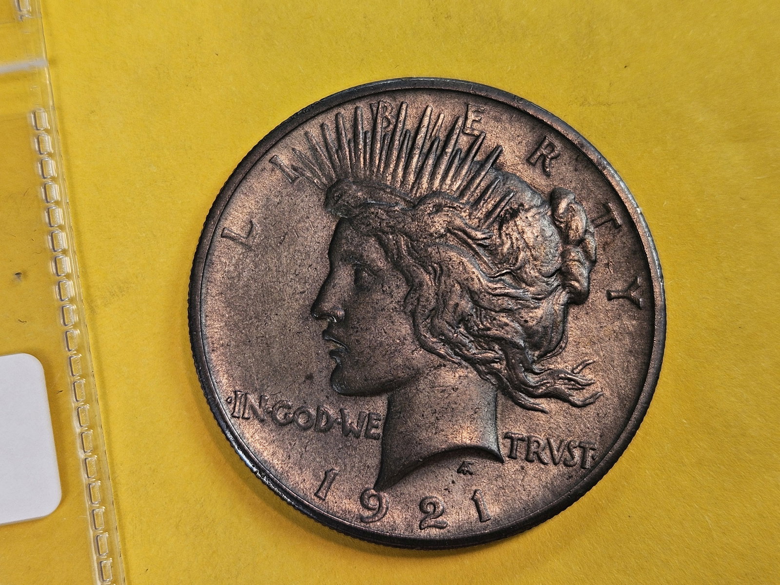 KEY DATE! 1921 Peace silve Dollar in About Uncirculated: First year issue. Toned