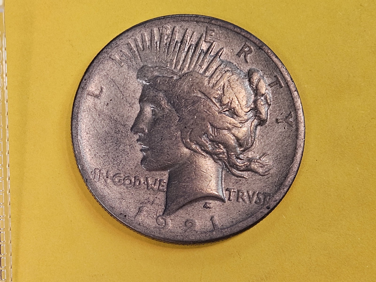 * Key Date * 1921 Peace silver Dollar in Fine: First year issue. Toned
