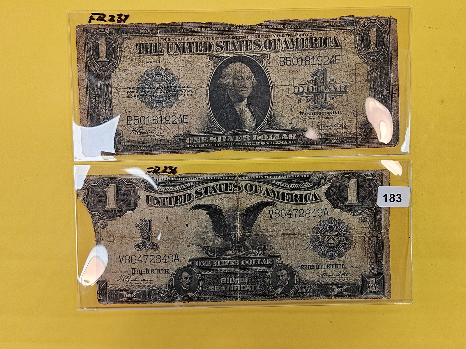Two Large Size One Dollar Silver Certificates: 1899 Black Eagle and a 1923