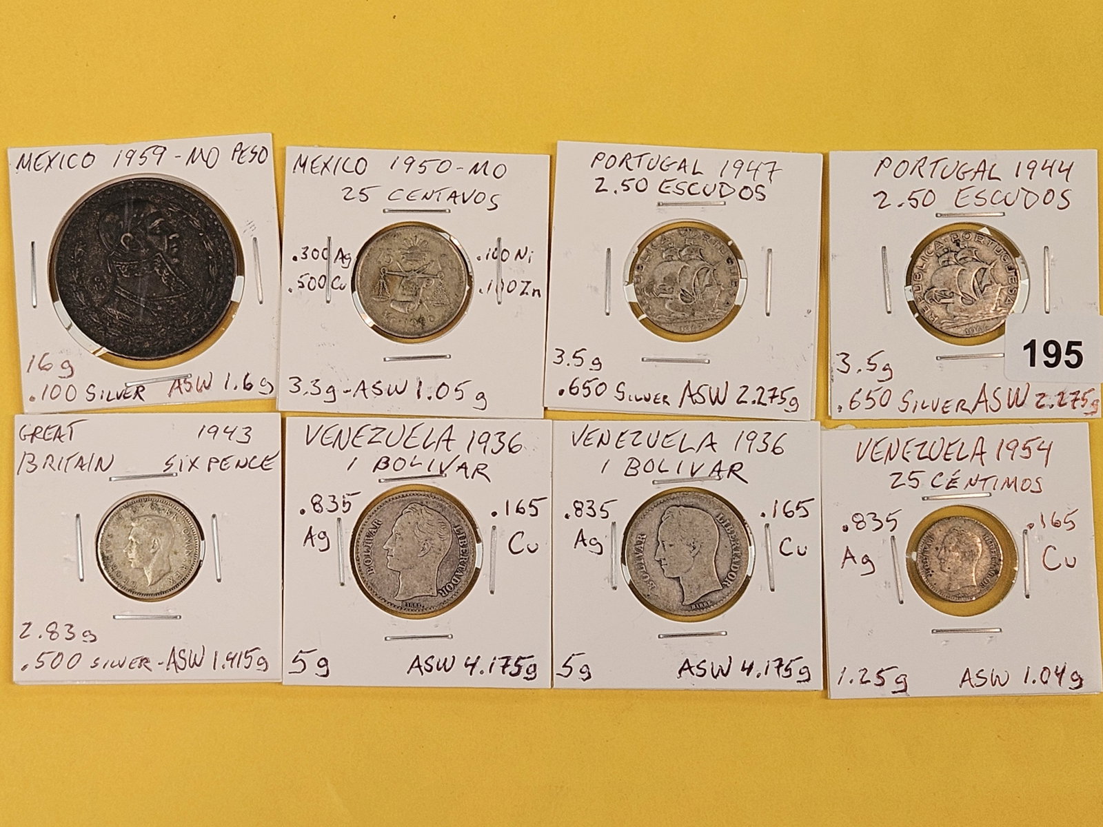 Eight mixed silver World coins: Mexico, Portugal, Great Britain and Venezuela
