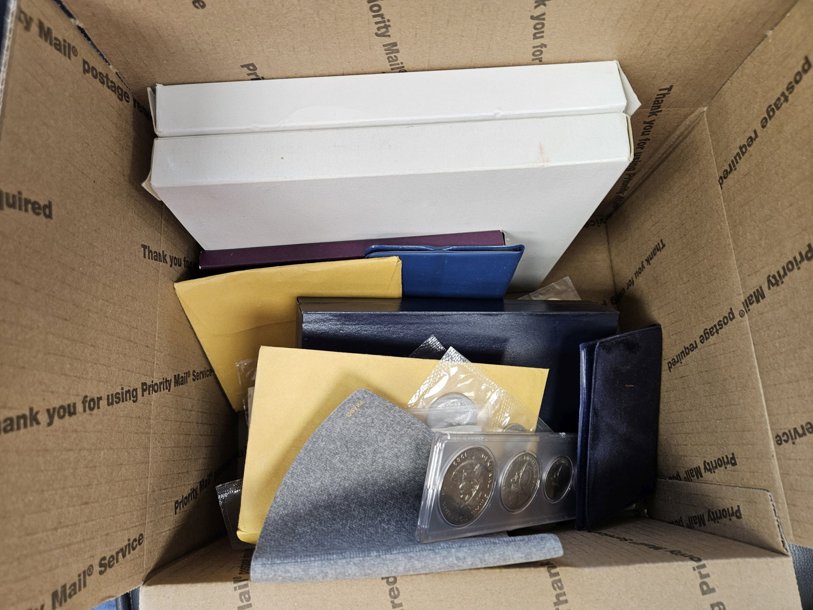 Twenty mixed World Coin Sets: Most in OGP. From all over. Ships Separately in a Flat Rate Medium Box