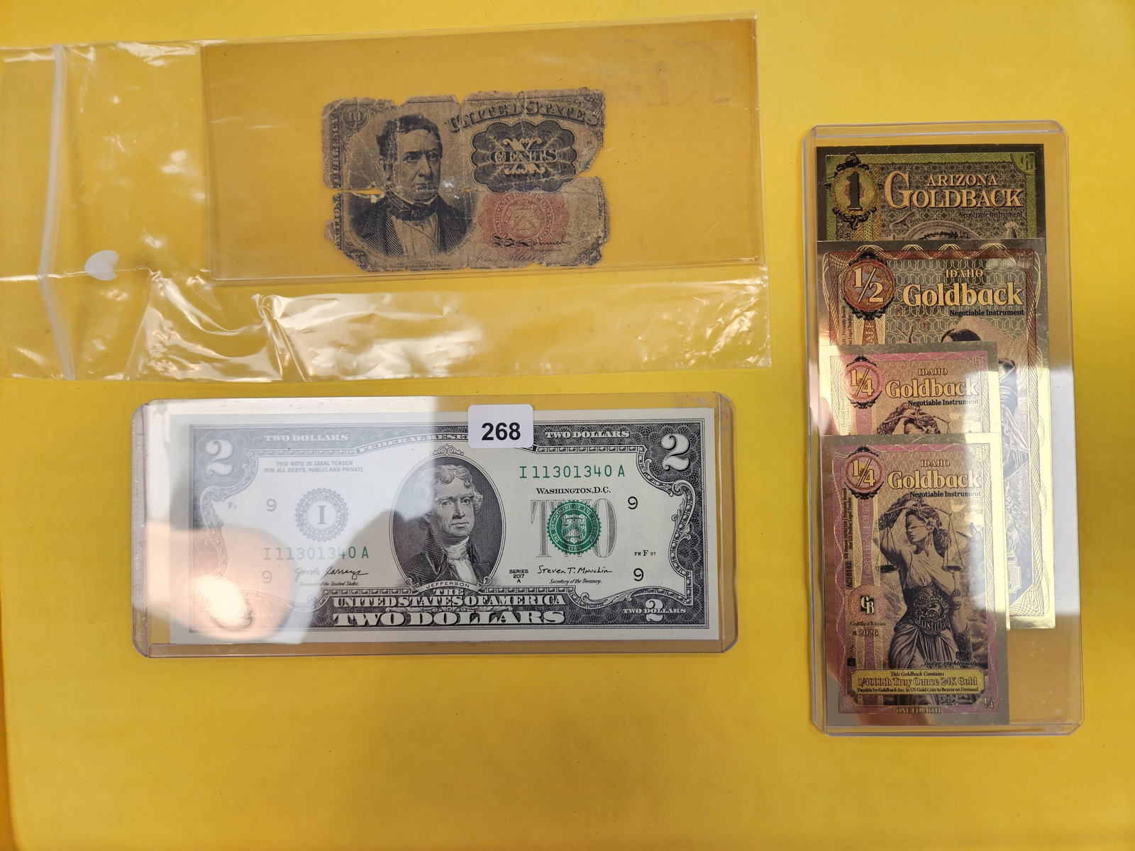 Hodge-Podge US Paper money lot: CU $2 Bill, Fractional 10 cent and four GOLDBACKS from Arizona and Idaho