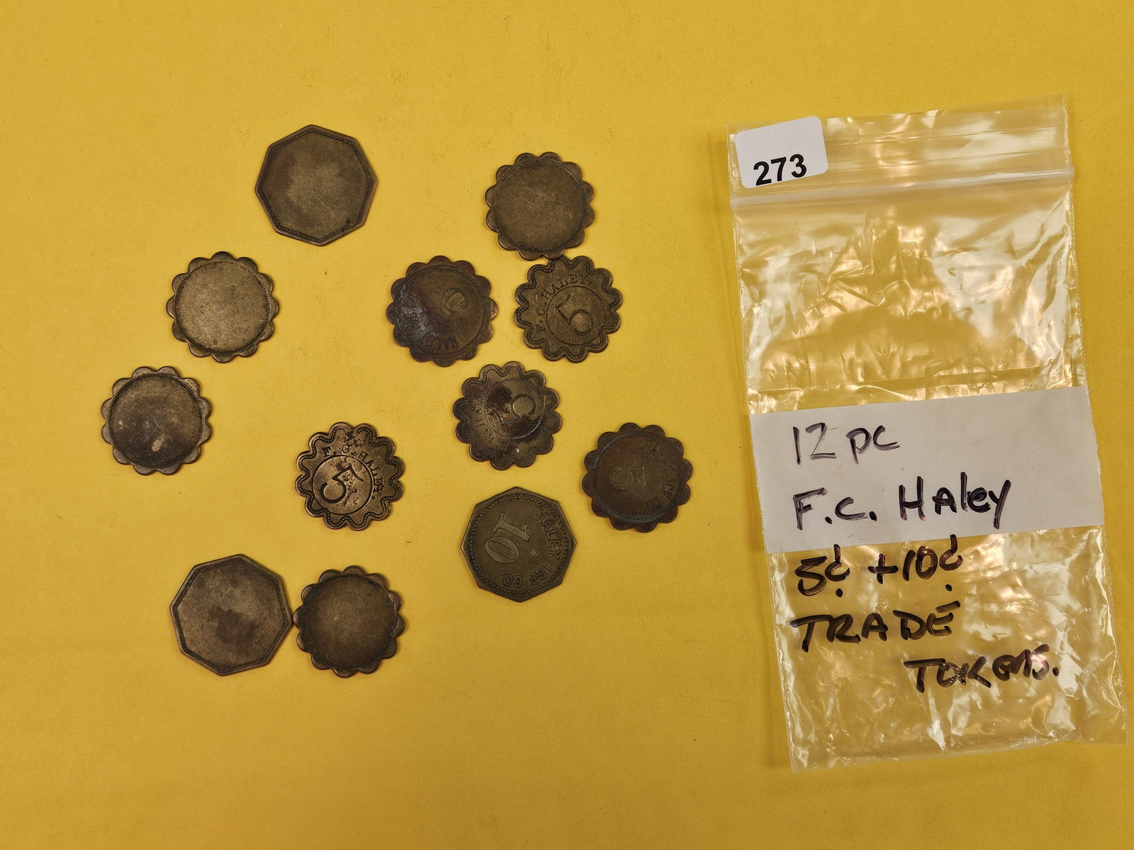 Scarcer Trade Tokens: Mix of Twelve F. C. Haley five and ten cent trade tokens