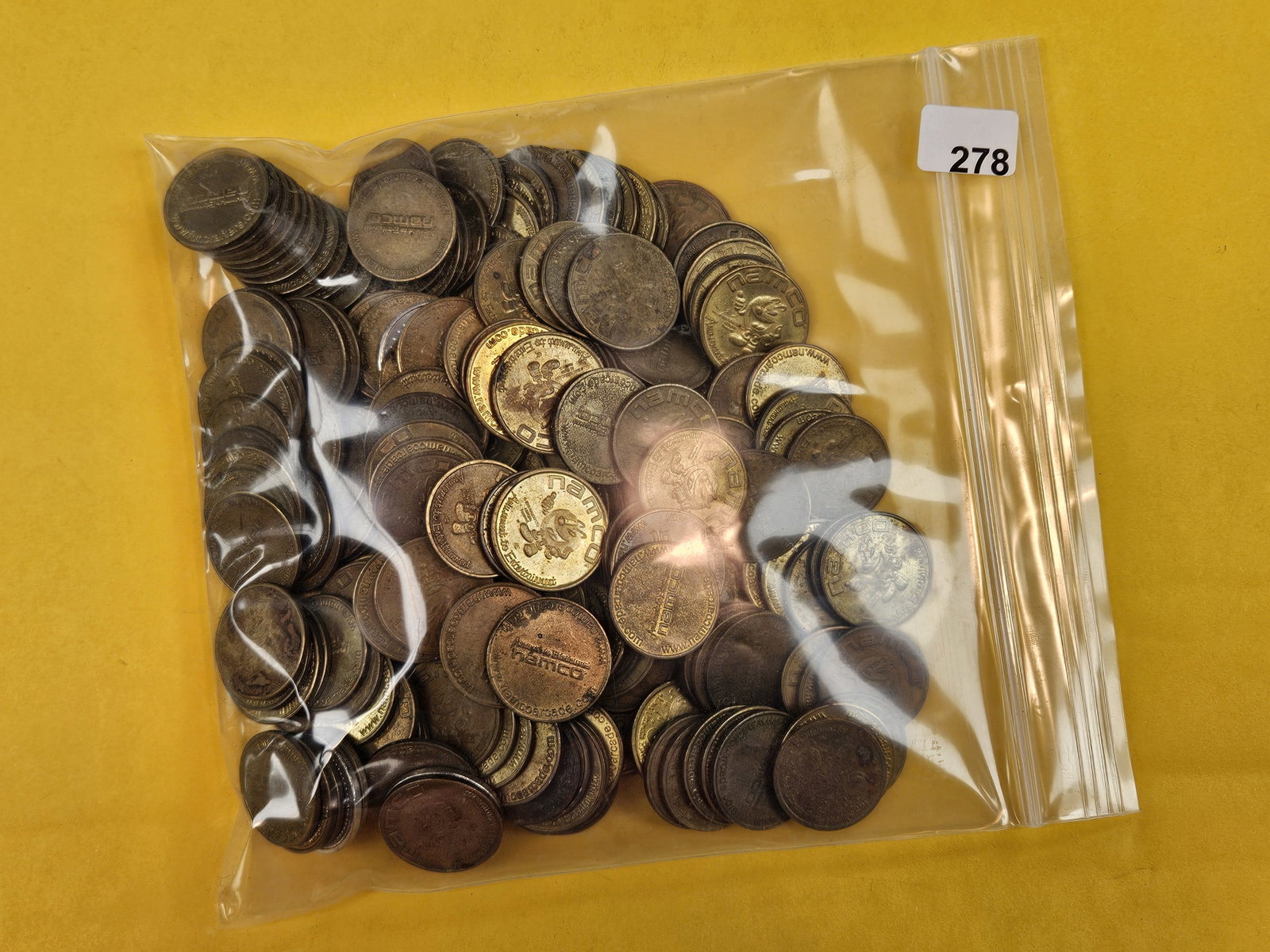 Two Pounds of mixed Tokens: I think they're all amusement tokens. Unchecked by us