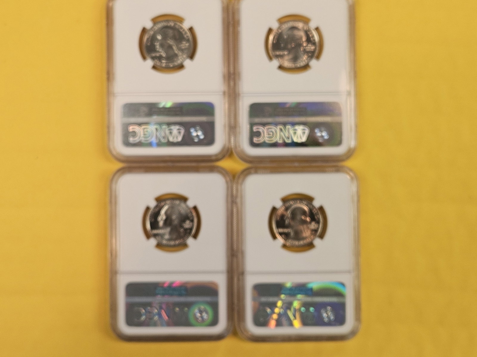 Four GEM to Superb GEM NGC-graded Washington Quarters - 2