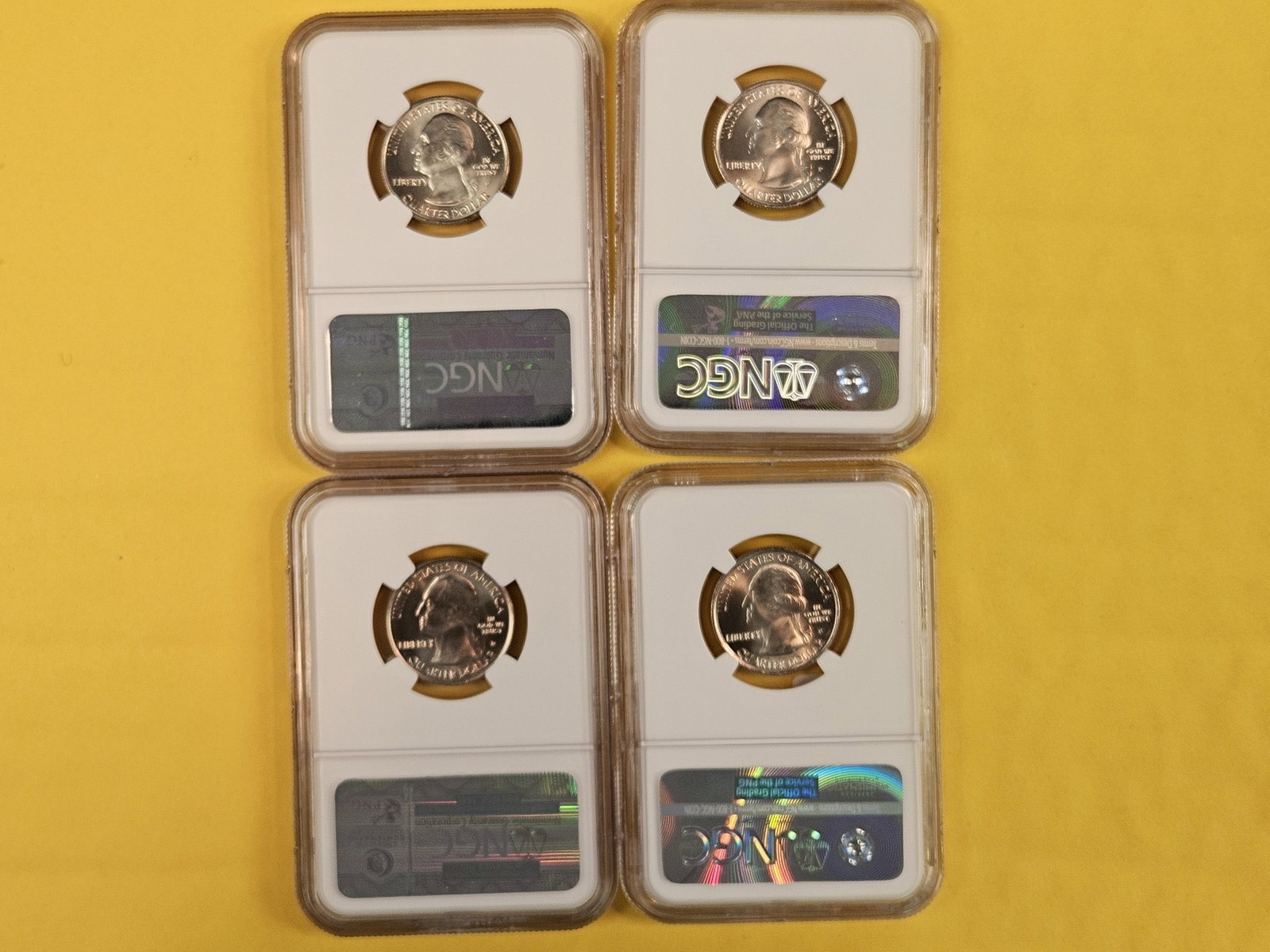 Four GEM to Superb GEM NGC-graded Washington Quarters - 2