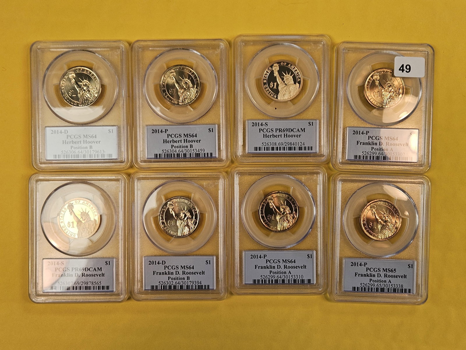 Eight PCGS-graded Presidential Dollars: Grades 64 through 69