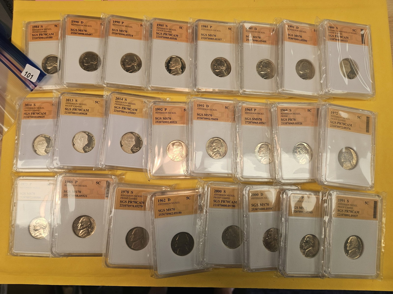 Twenty-four mixed Jefferson nickels: Nice! All in off-brand slabs