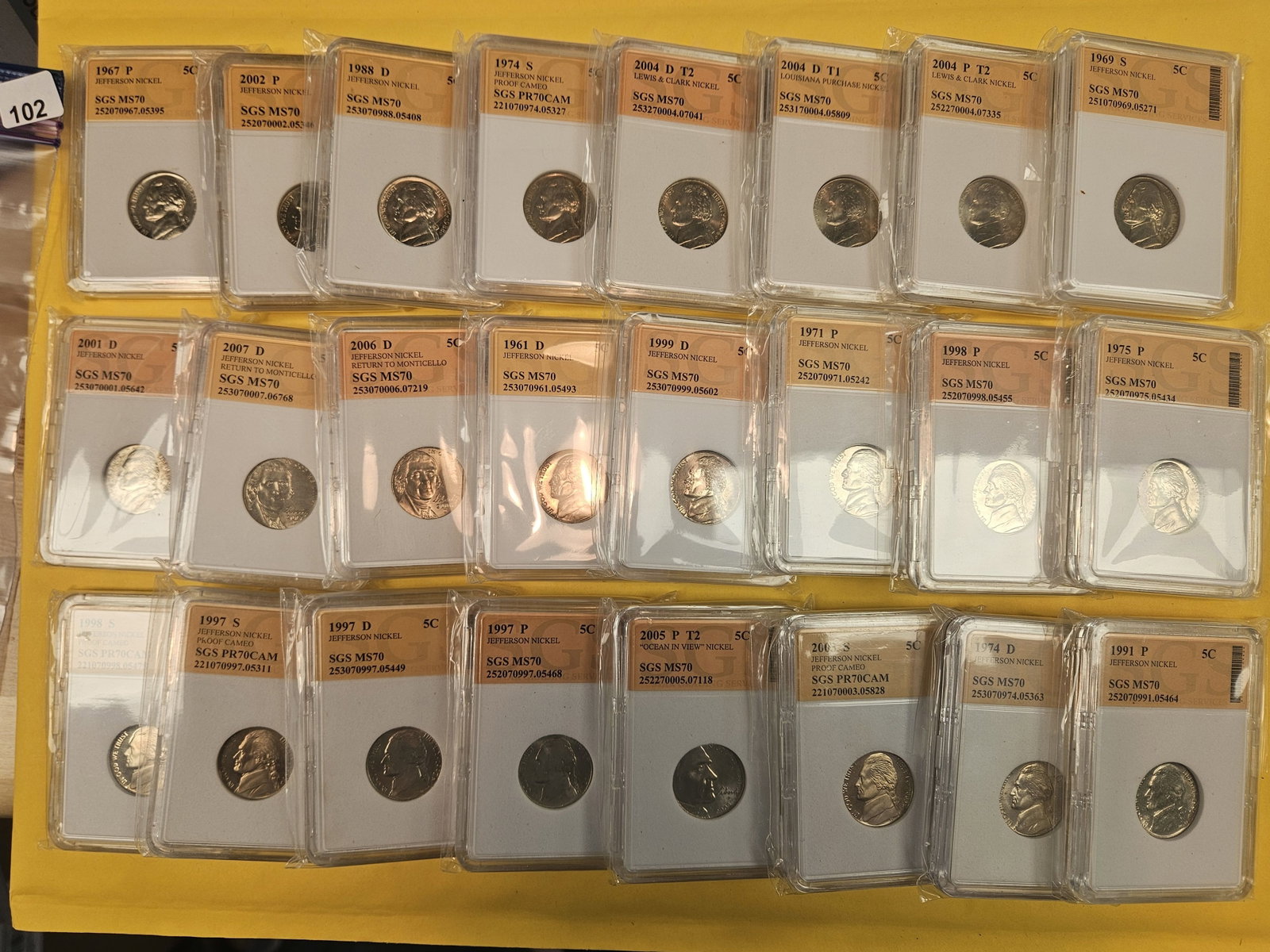 Twenty-four mixed Jefferson nickels: Nice! All in off-brand slabs