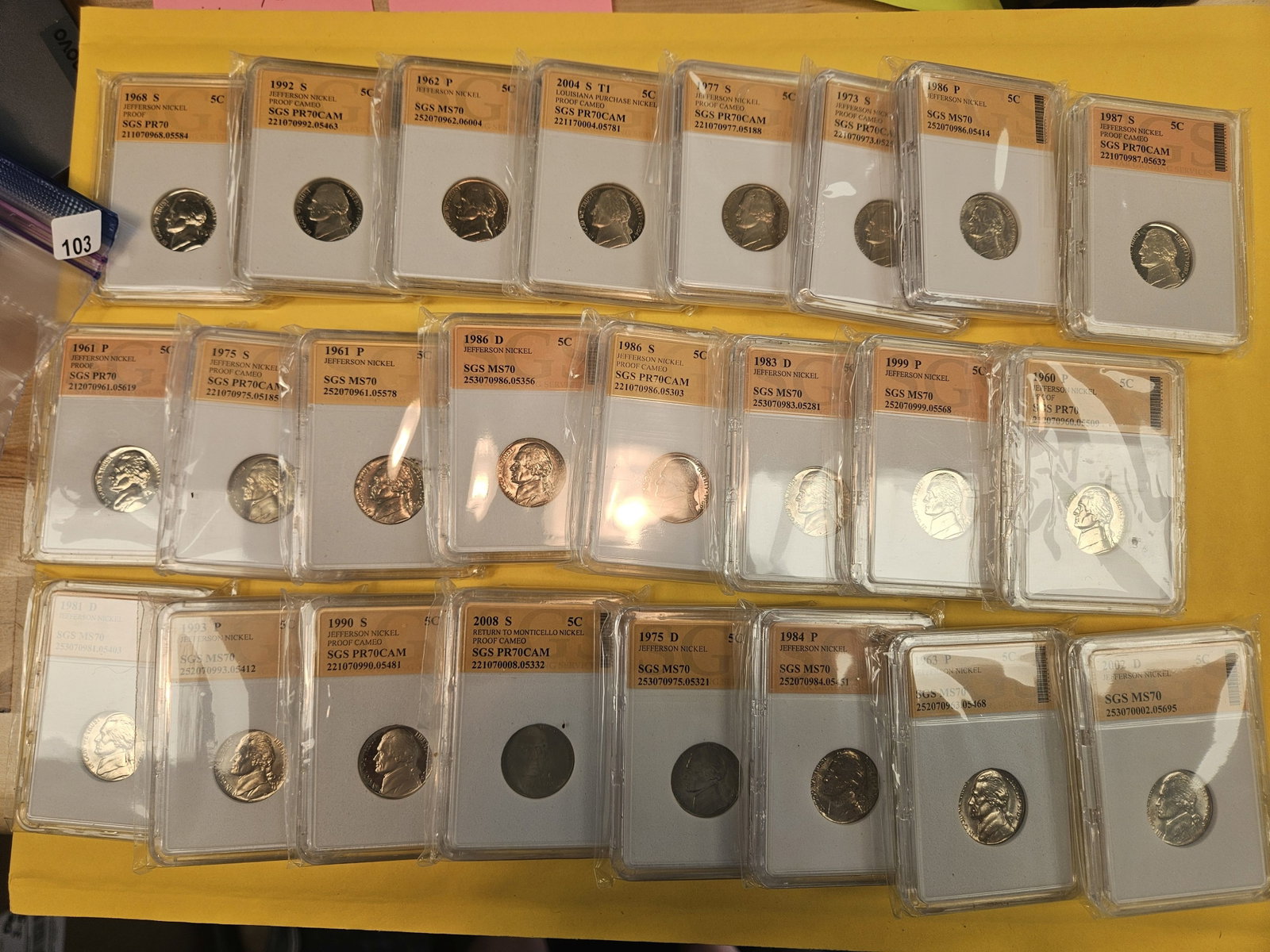 Twenty-four mixed Jefferson nickels: Nice! All in off-brand slabs