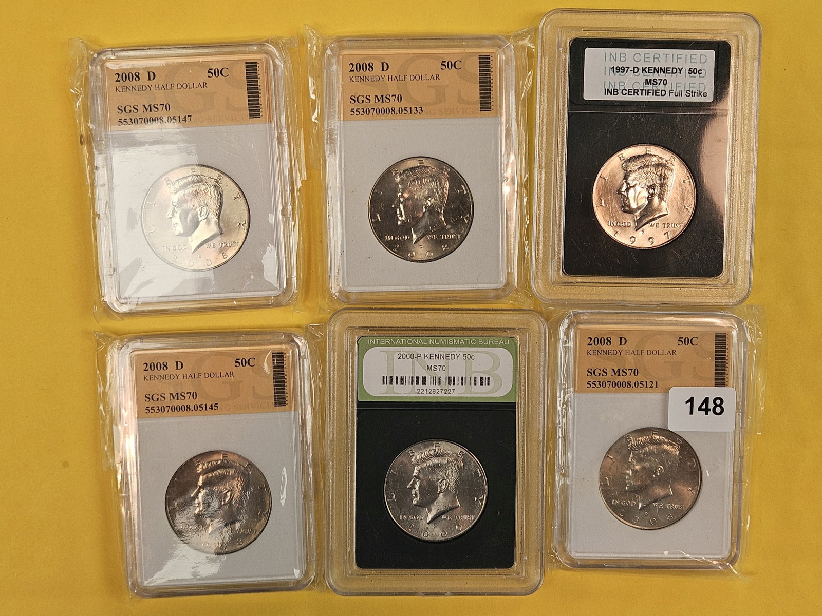 Six GEM Brilliant Uncirculated Kennedy half Dollars: All clad