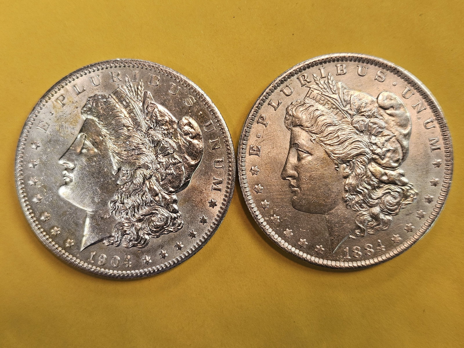 Two Brilliant About Uncirculated Plus Morgan Silver Dollars: 1904-O and 1884-O
