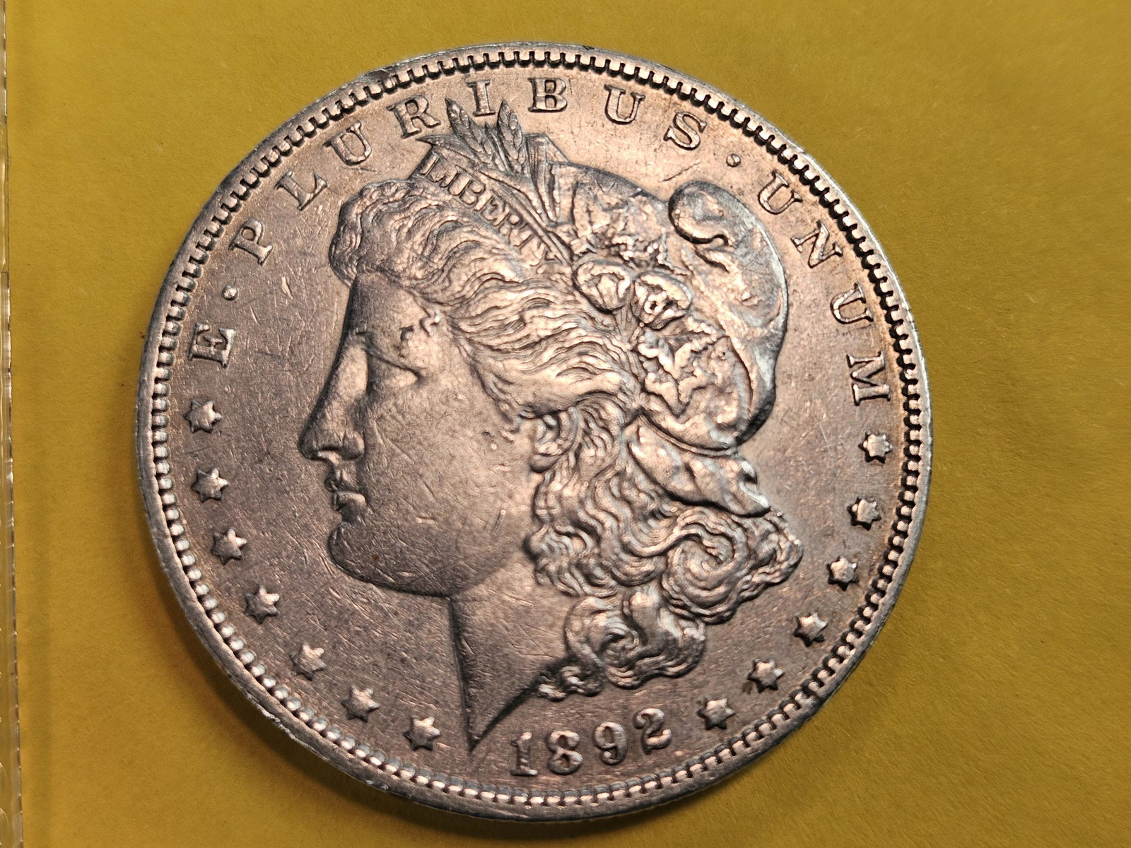 Better Date 1892-O Morgan Silver Dollar: In About Uncirculated