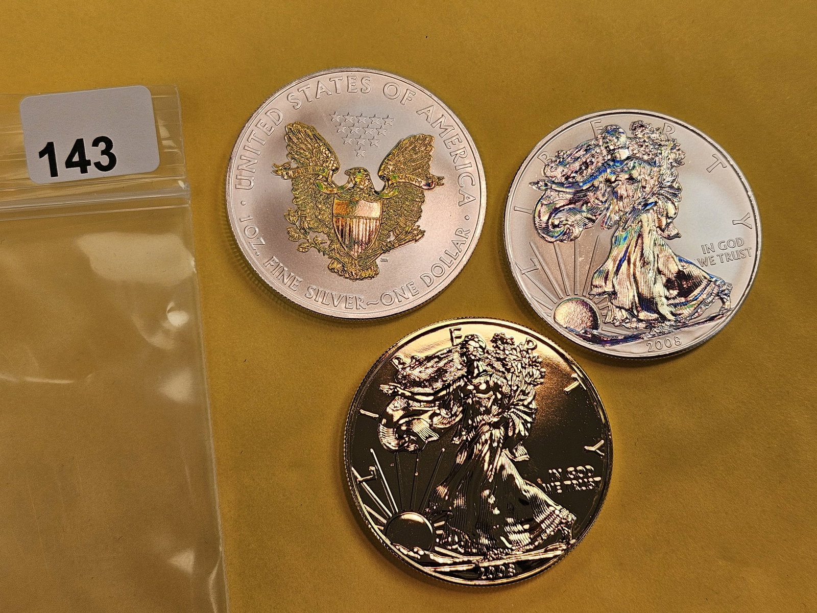Three colorized American Silver Eagles - 2