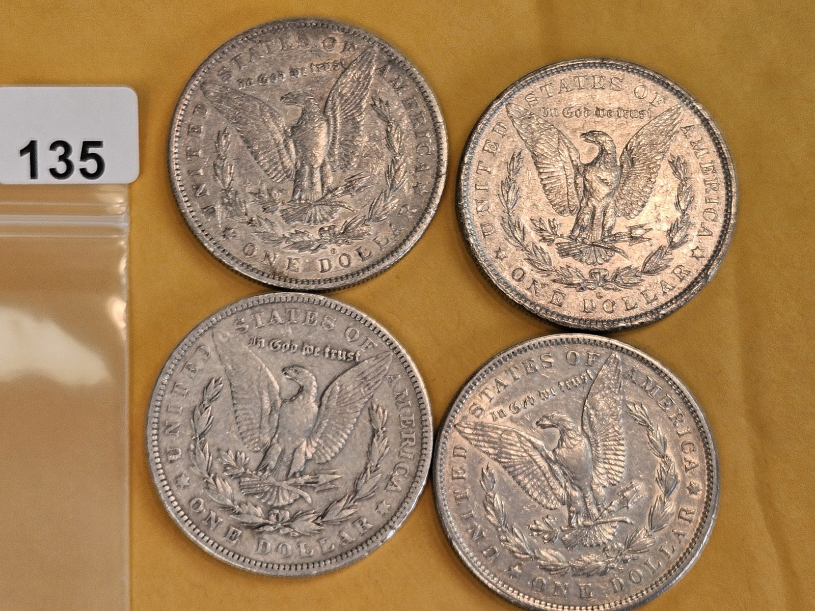 Four mixed Morgan Silver Dollars - 2