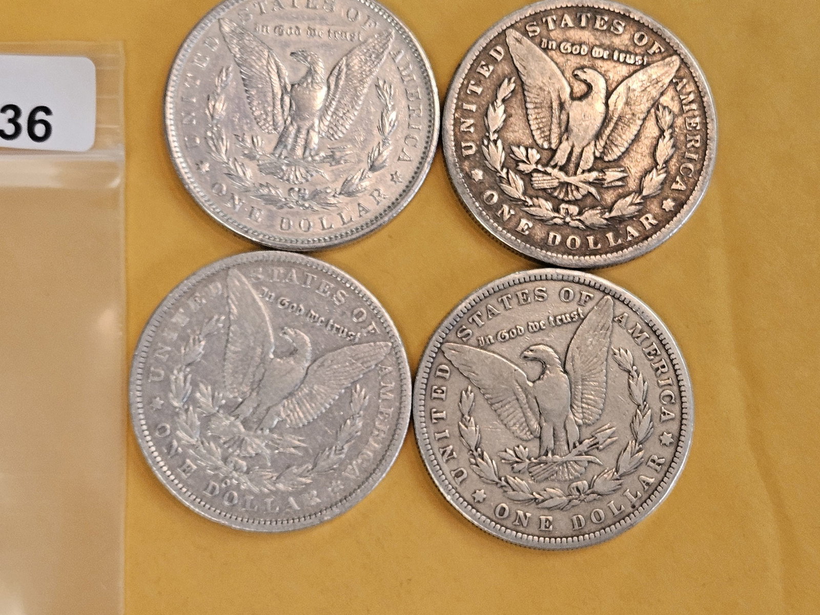 Four mixed Morgan Silver Dollars - 2