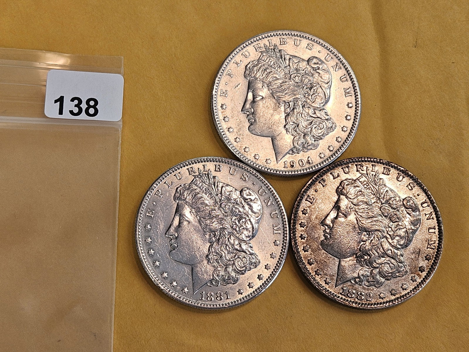 Three mixed Morgan Silver Dollars - 2