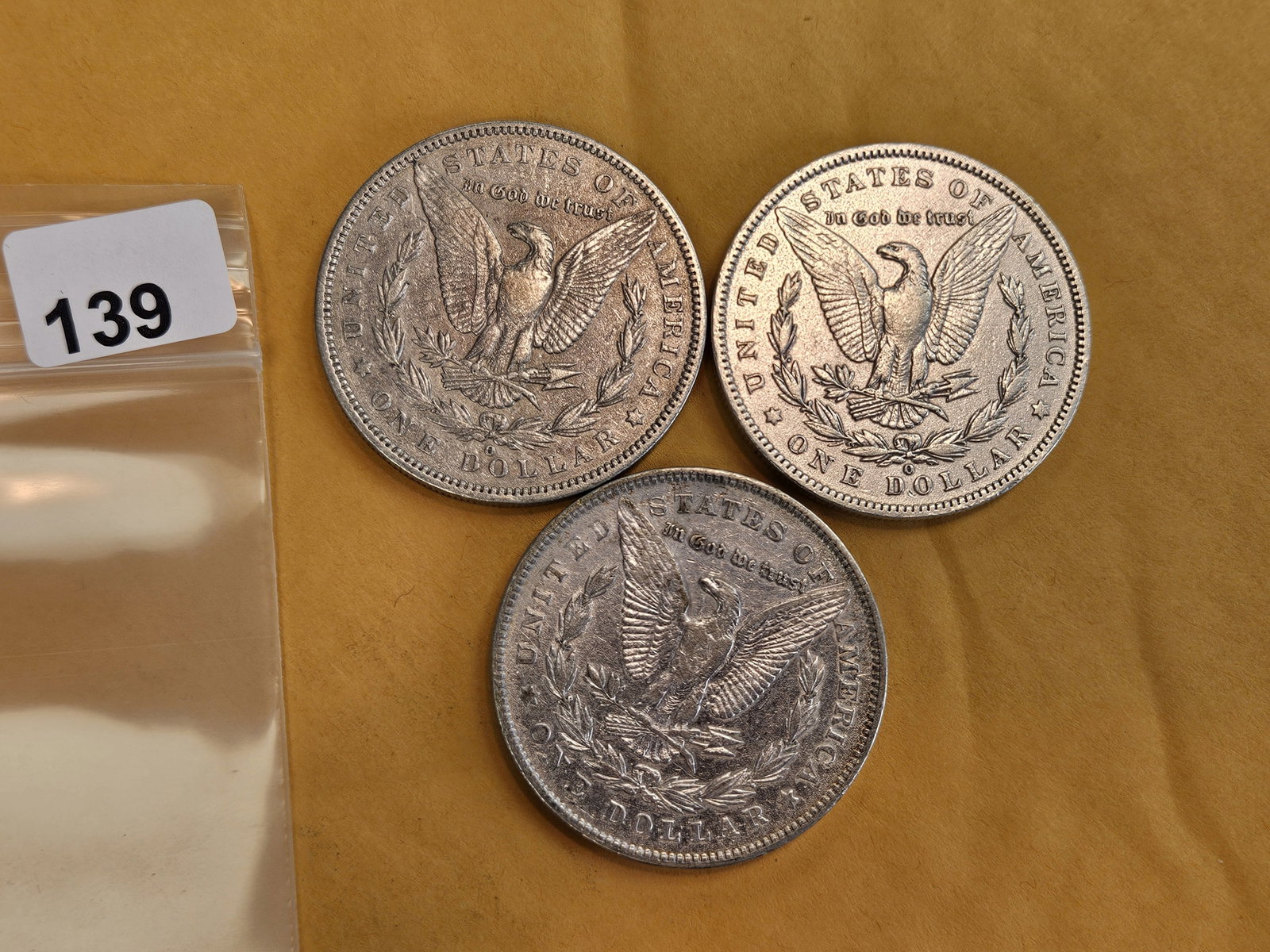 Three mixed Morgan Silver Dollars - 2