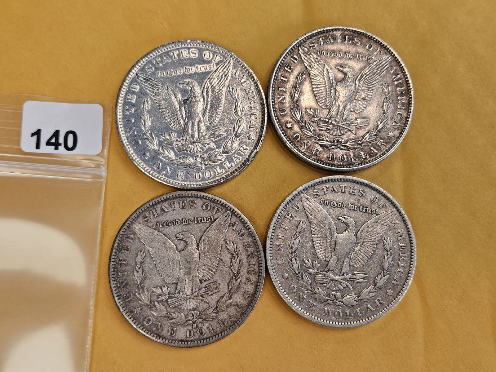 Four mixed Morgan Silver Dollars - 2