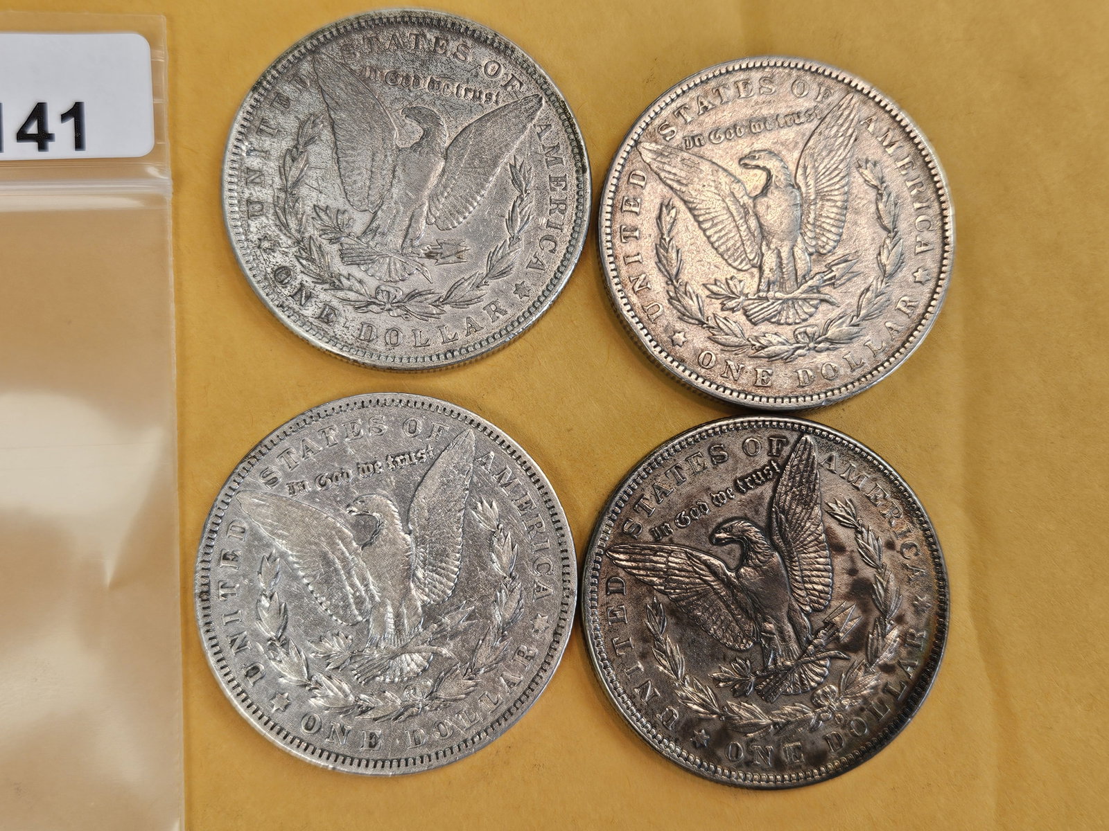 Four mixed Morgan Silver Dollars - 2