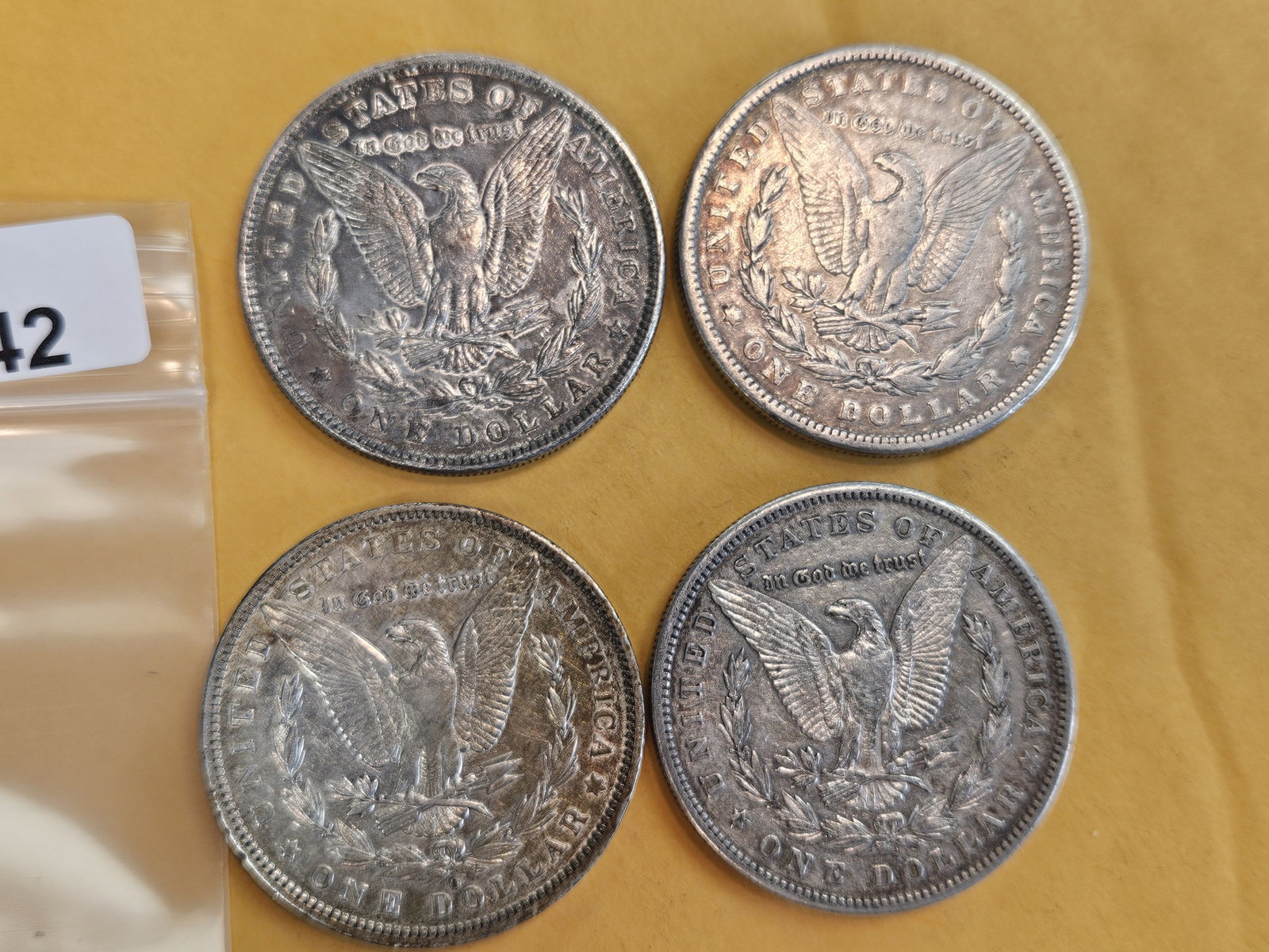 Four mixed Morgan Silver Dollars - 2