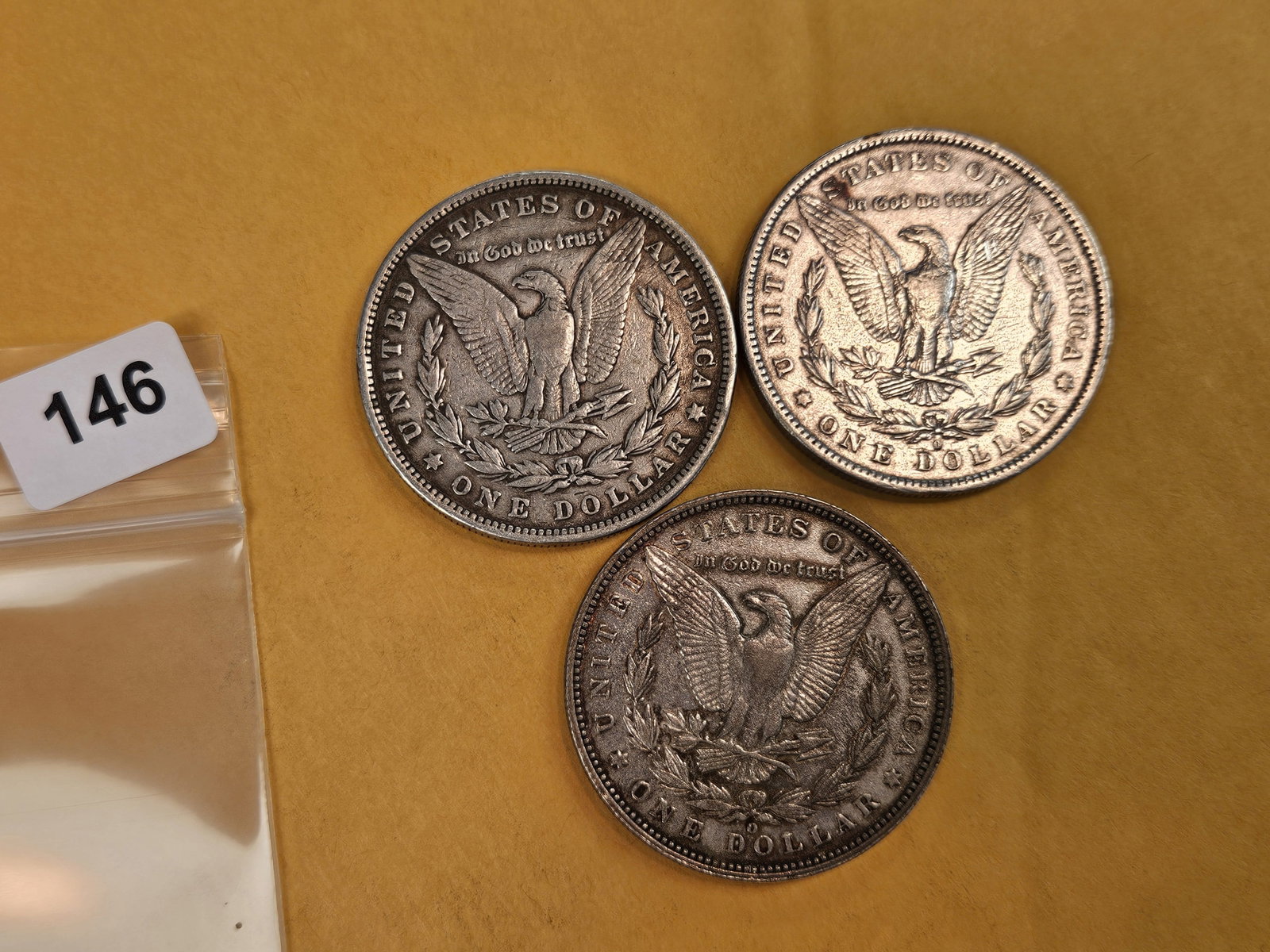 Three mixed Morgan Silver Dollars - 2
