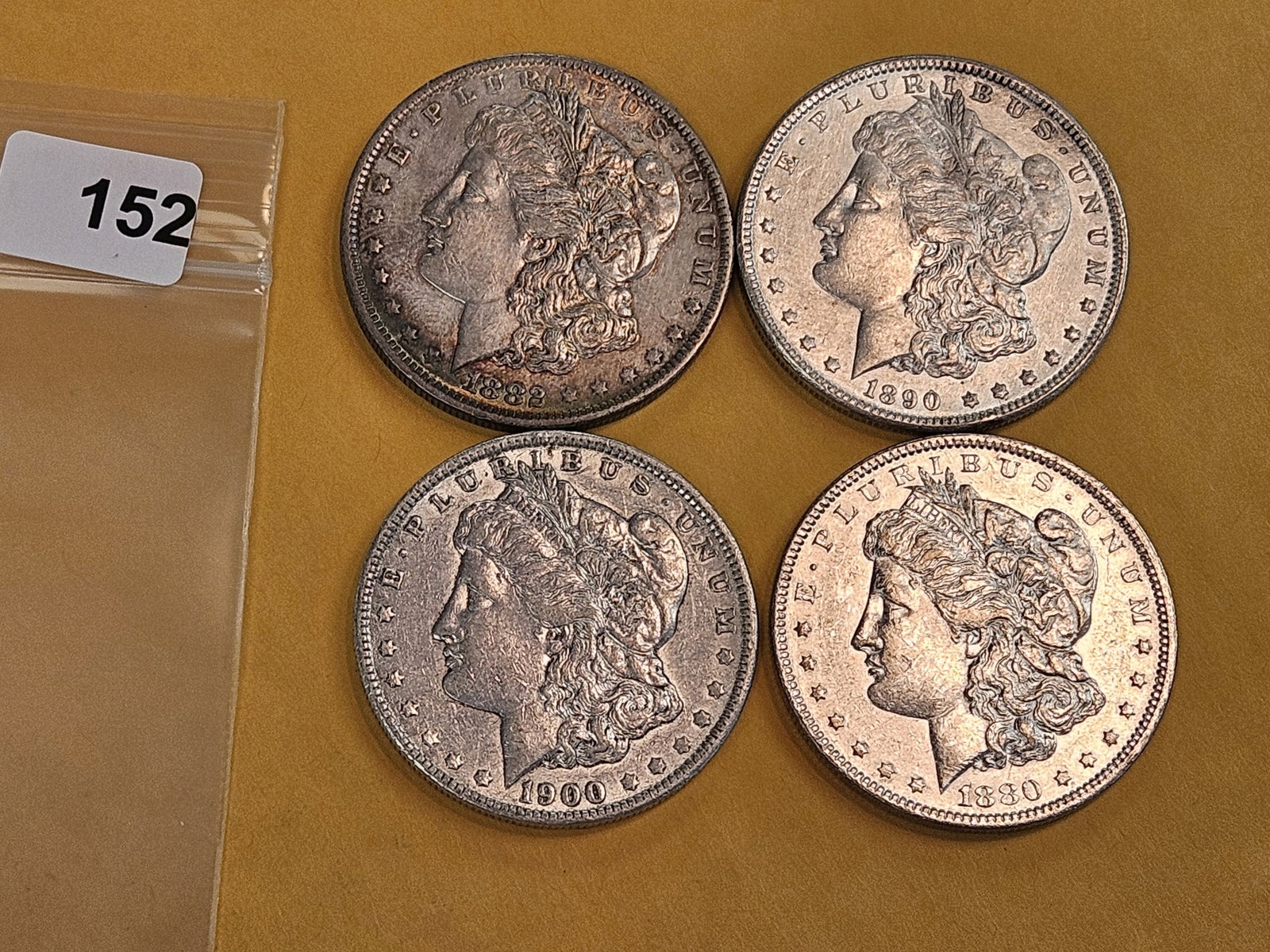 Four mixed Morgan Silver Dollars - 2